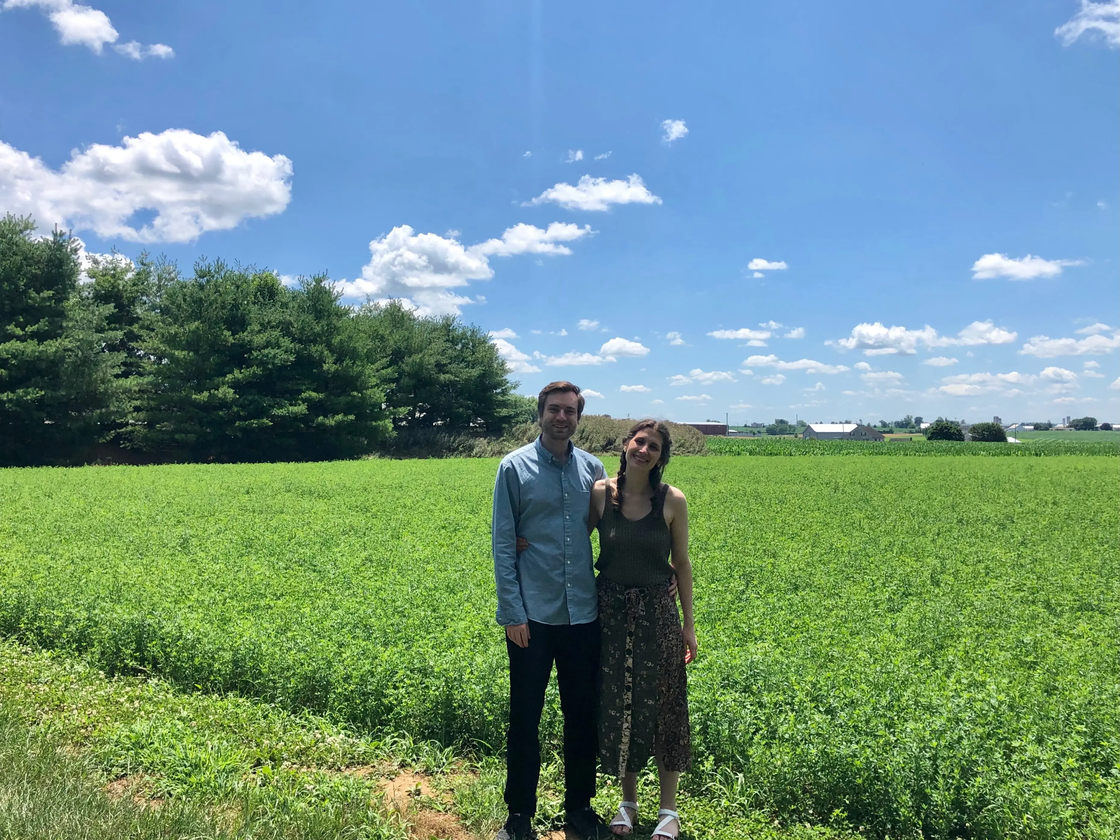 Man and woman smiling in field in Ephrata