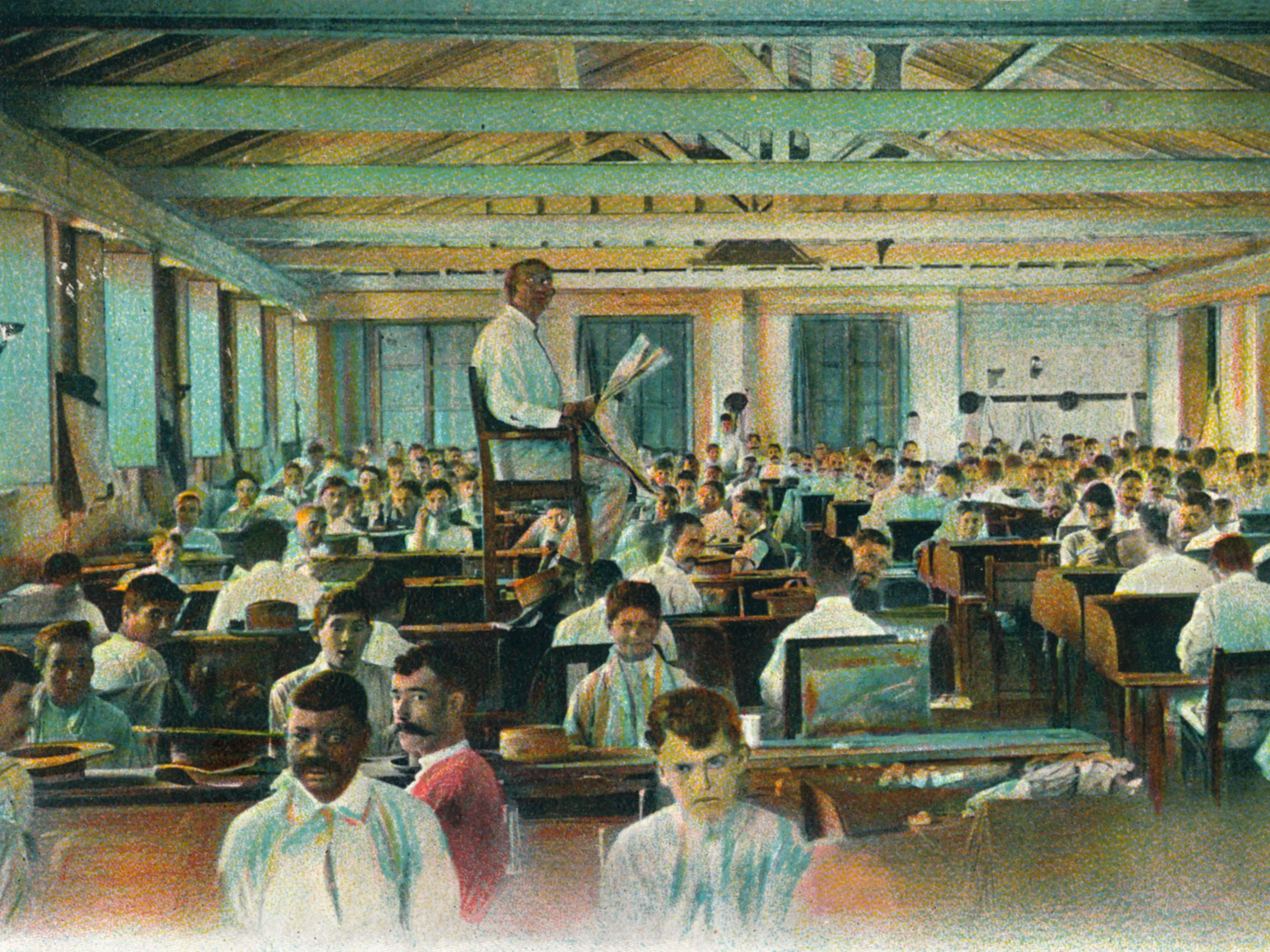 A lector reads to cigar rollers in a cigar factory, Havana, Cuba.
