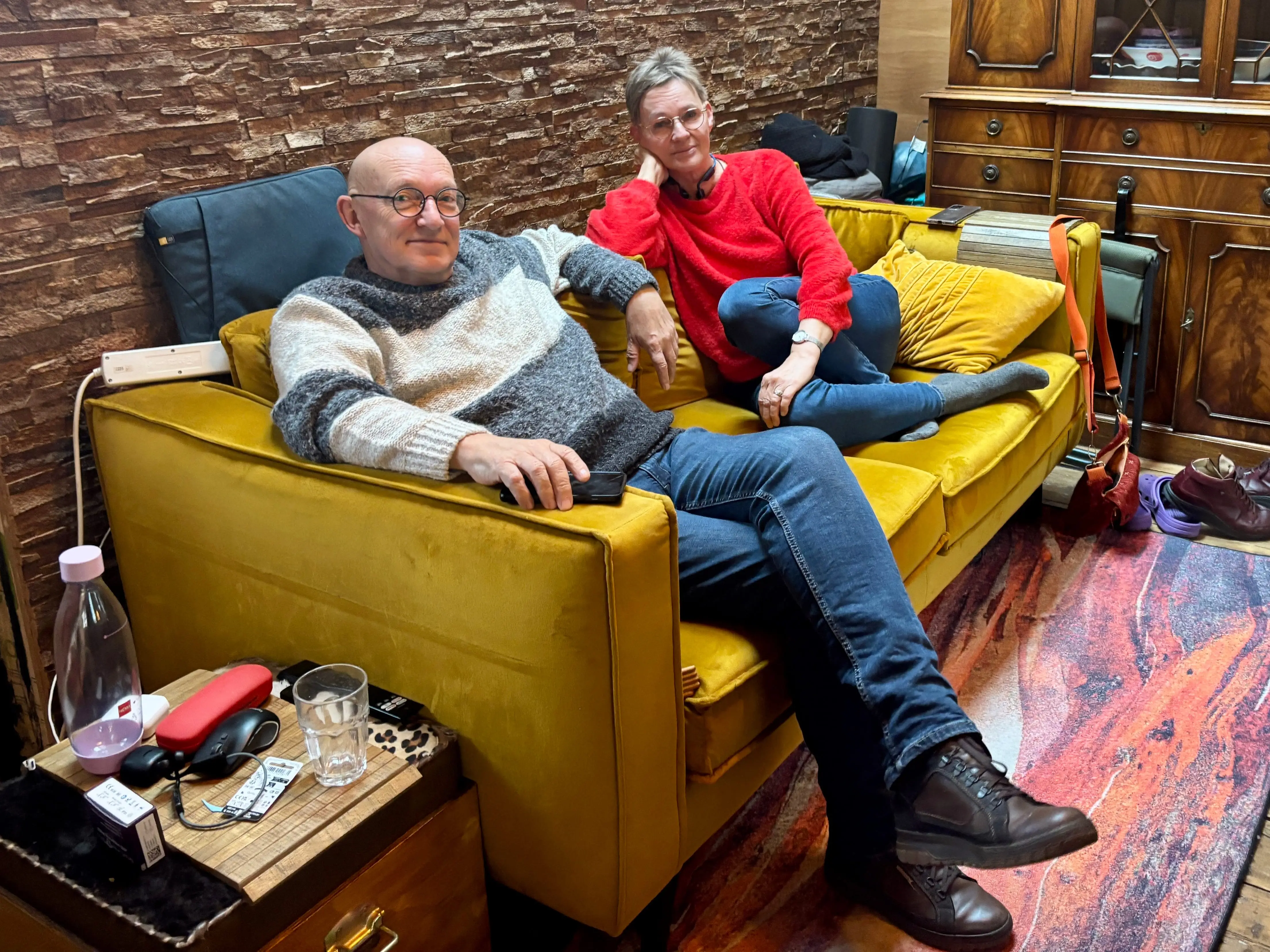 Margareth Bluigmars, 64, and Nico Bluigmars, 68, on a couch