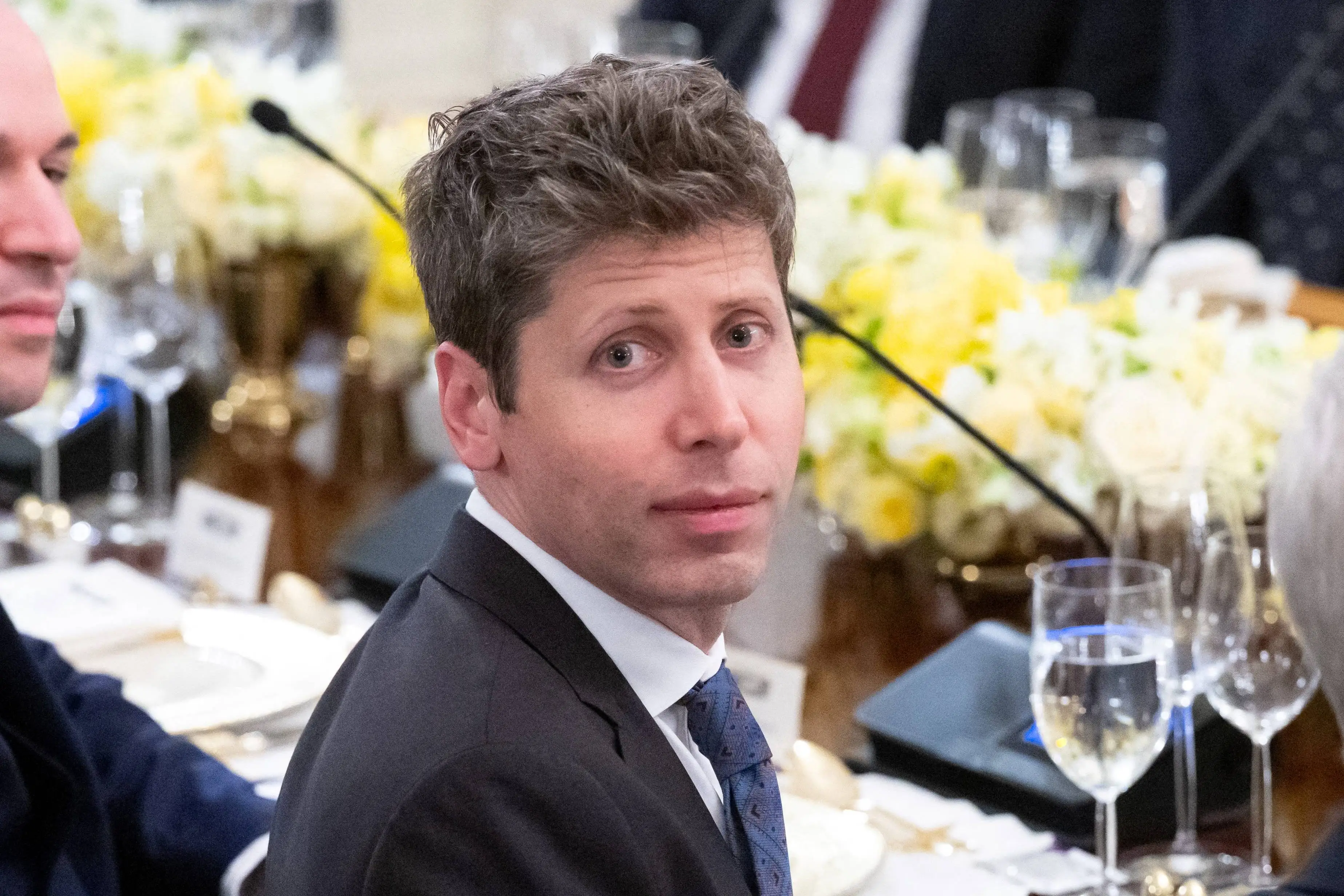 sam altman staring at camera