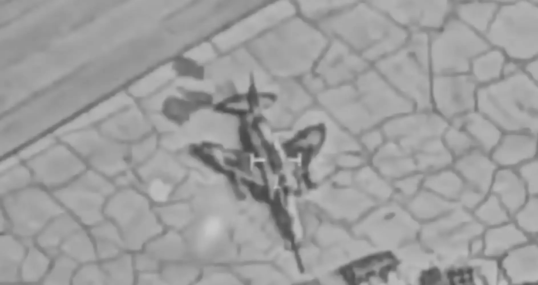 An aircraft is seen on tarmac. The picture is black and white.