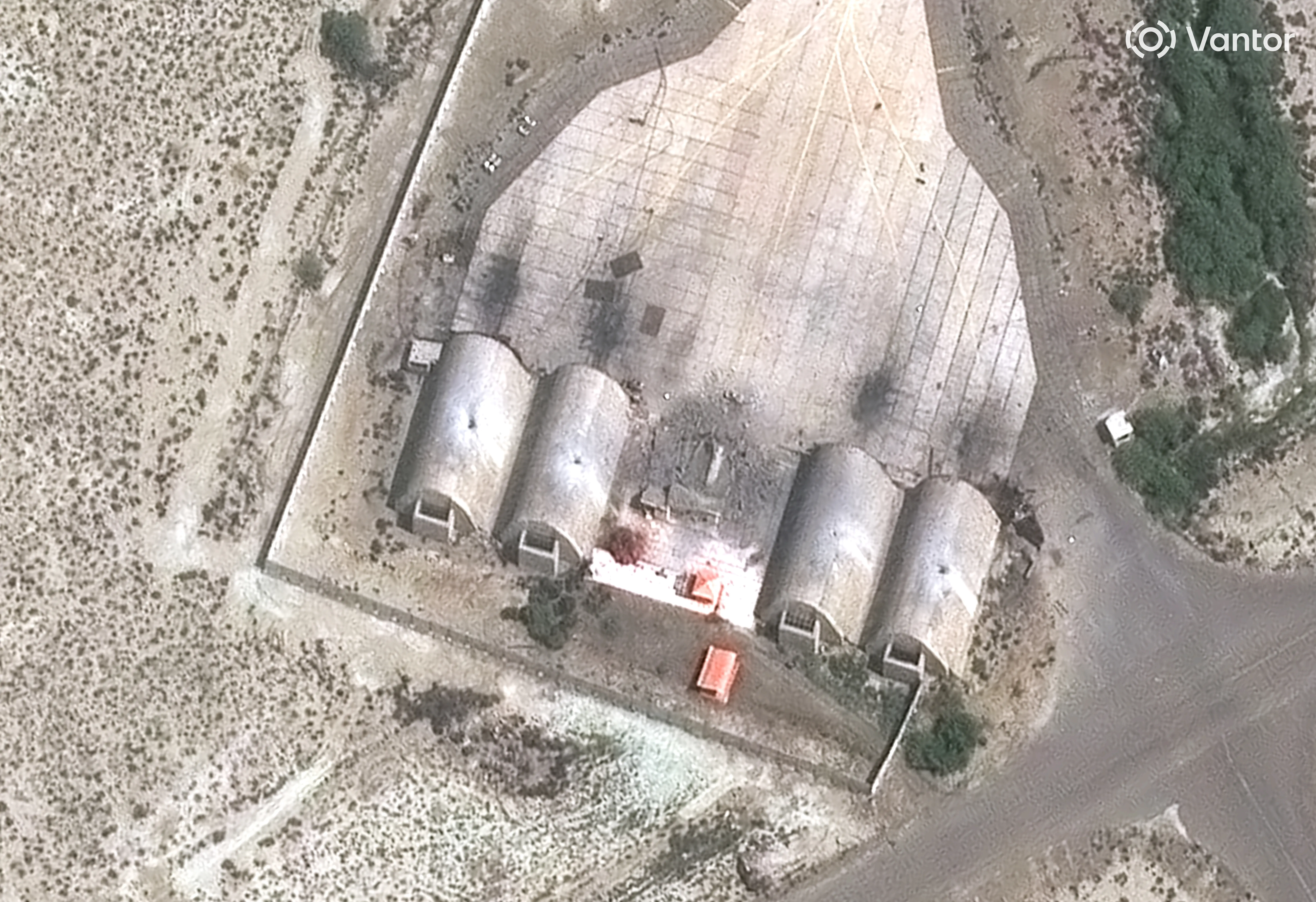 A close-up view of strikes on aircraft shelters at an airbase in Konarak, Iran.