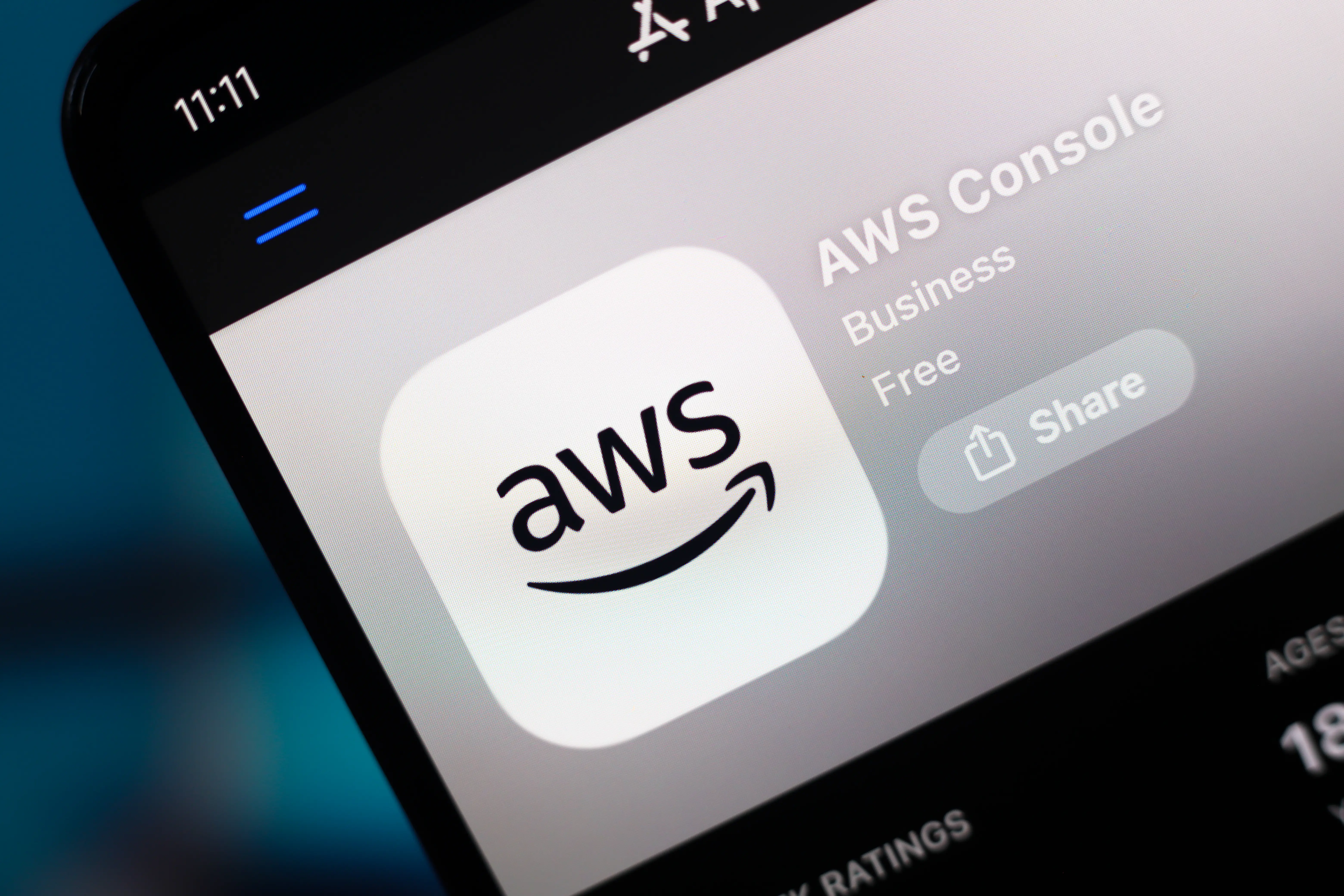 The AWS (Amazon Web Services) logo appears on a smartphone screen in the Apple app store in this photo illustration in Ontario, Canada, on February 26, 2026.