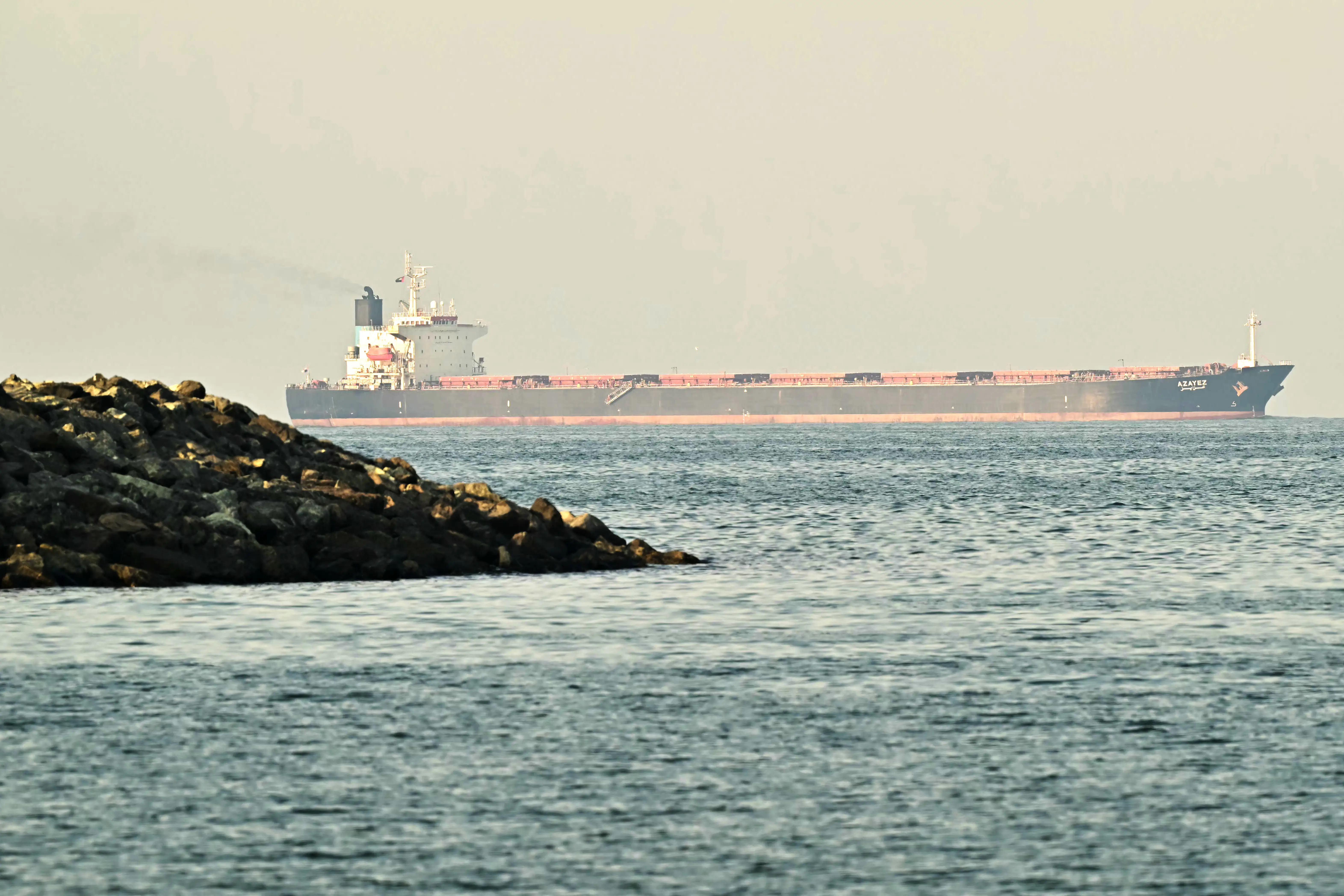 A cargo ship is pictured off coast city of Fujairah, in the Strait of Hormuz.