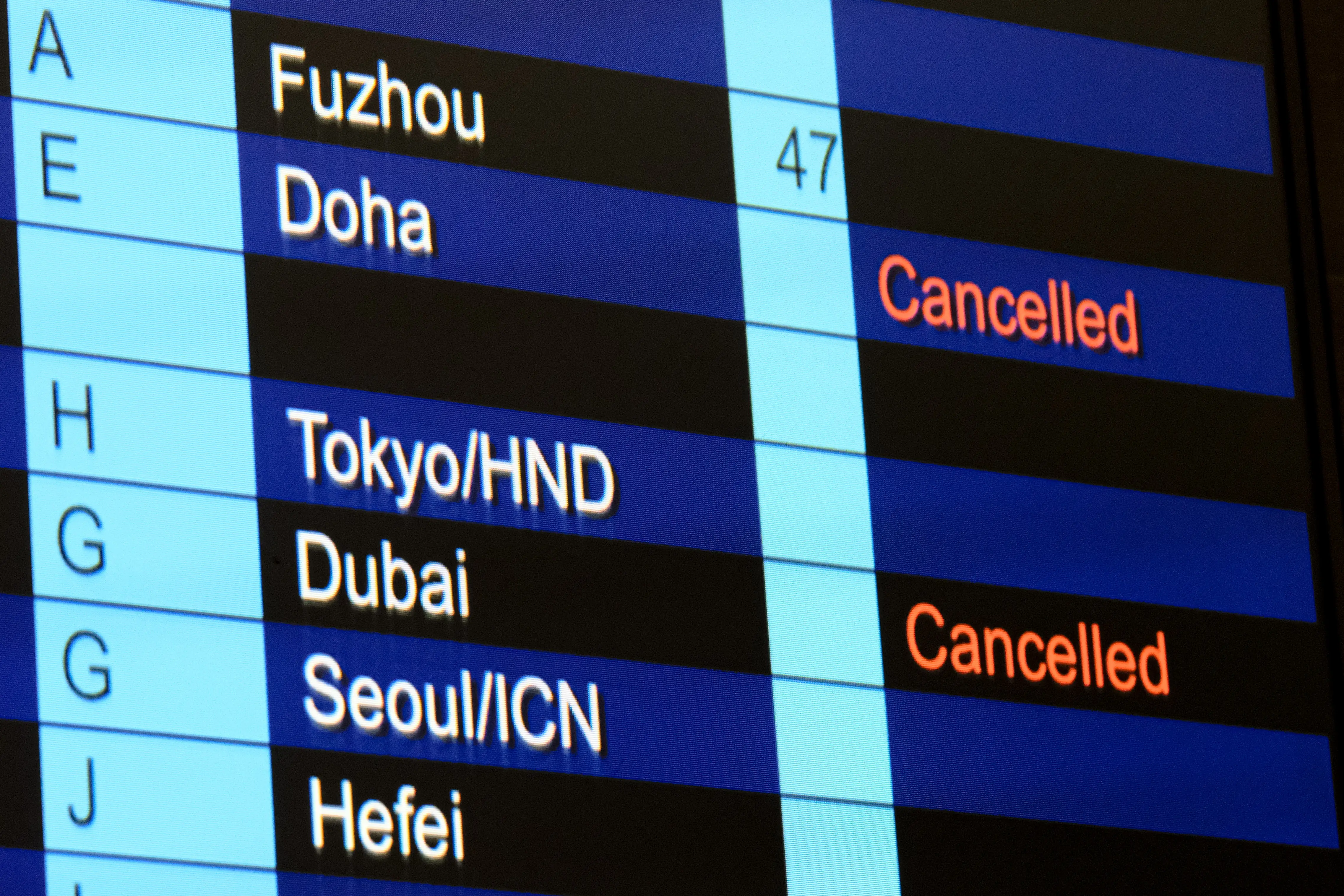 HONG KONG, CHINA - MARCH 02: Cancelled flights to Dubai and Doha shown on flight information display at Hong Kong International Airport on March 2, 2026, in Hong Kong, China. (Photo by Sawayasu Tsuji/Getty Images)