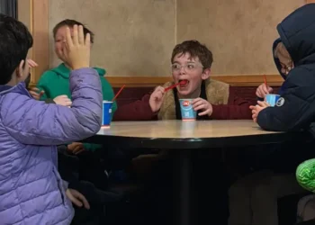 My 8-year-old invited his 4 best friends for dinner. I sat at a separate table and watched them have fun independently.