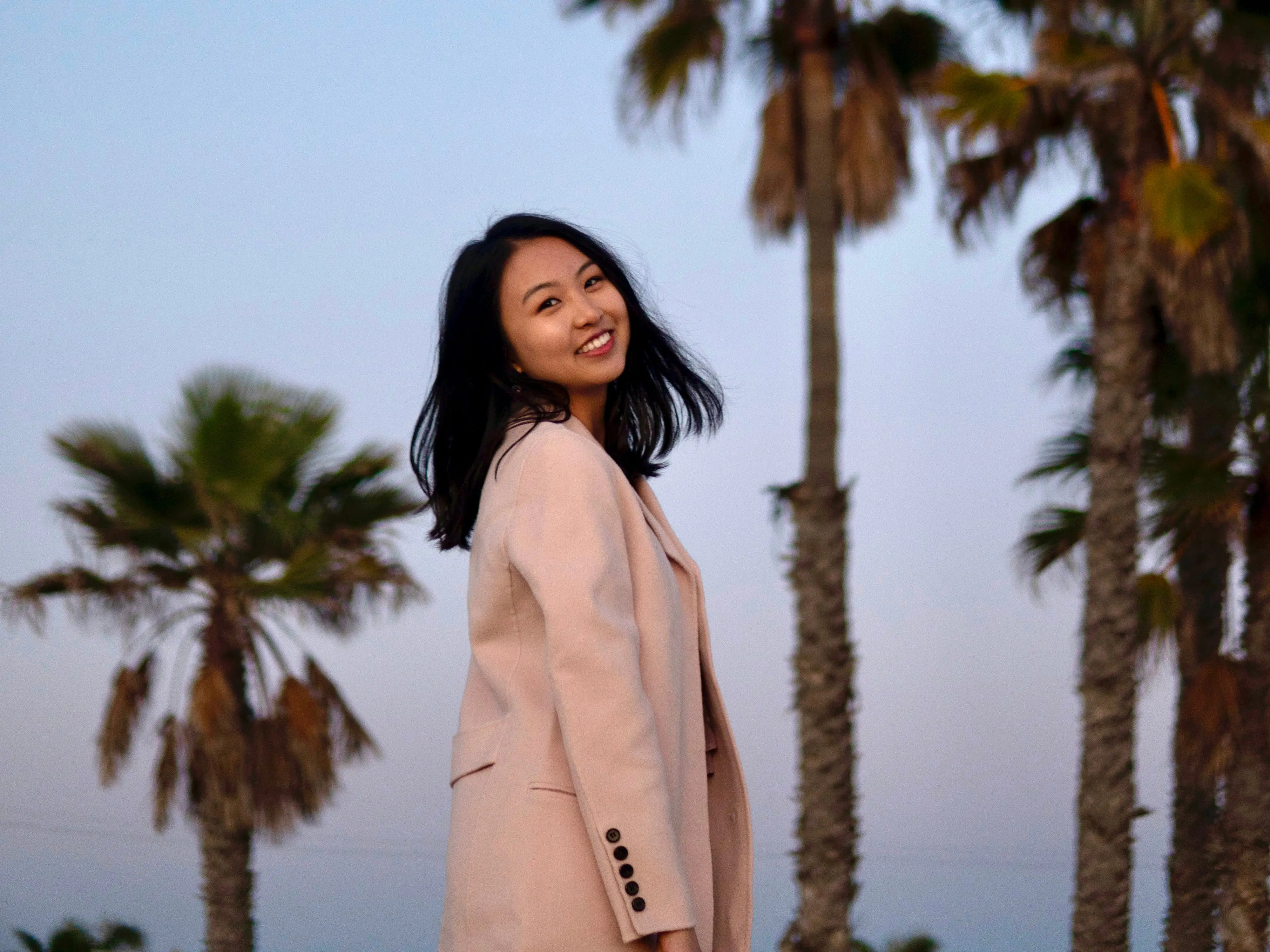 Sherri Lu in front of LA palm trees