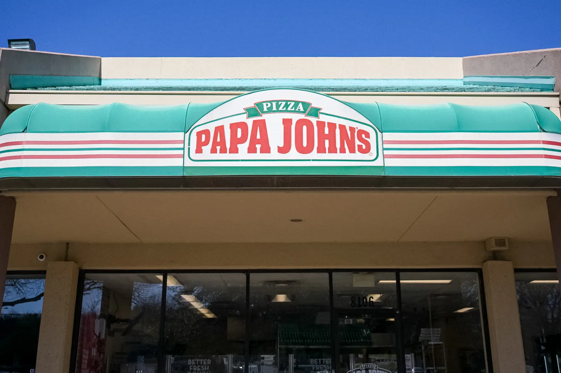 A Papa John's restaurant is seen on February 27, 2026 in Austin, Texas. Papa John's international is preparing to close 300 of its Northern American stores by the end of 2027 in an effort to further turnaround business amid nationwide ongoing pizza sector struggles.