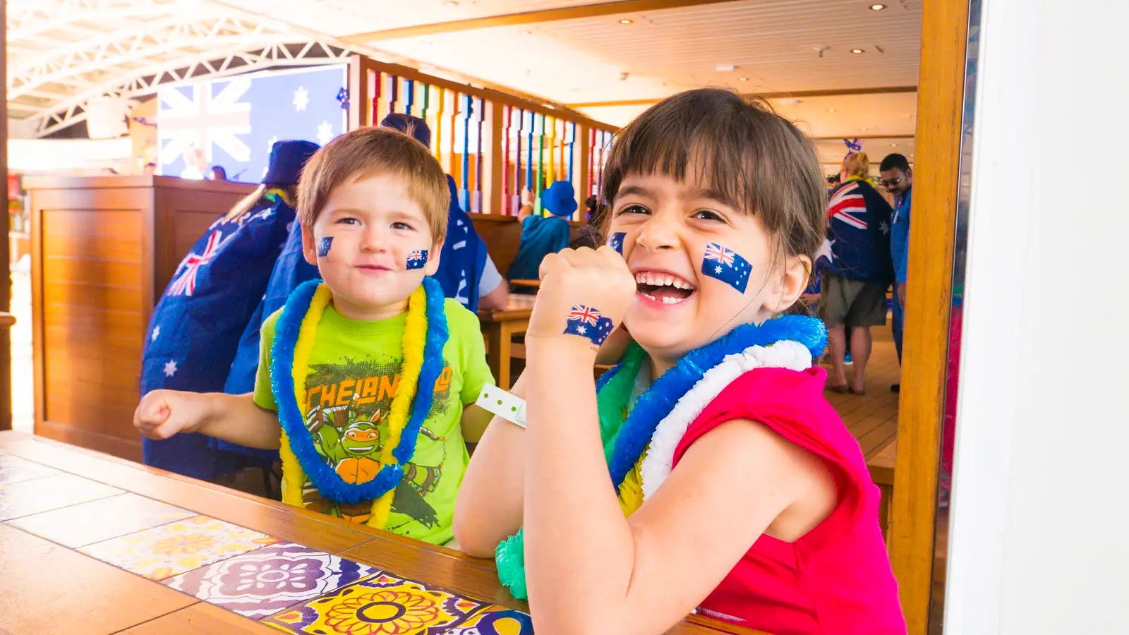 Kids smiling wearing leis