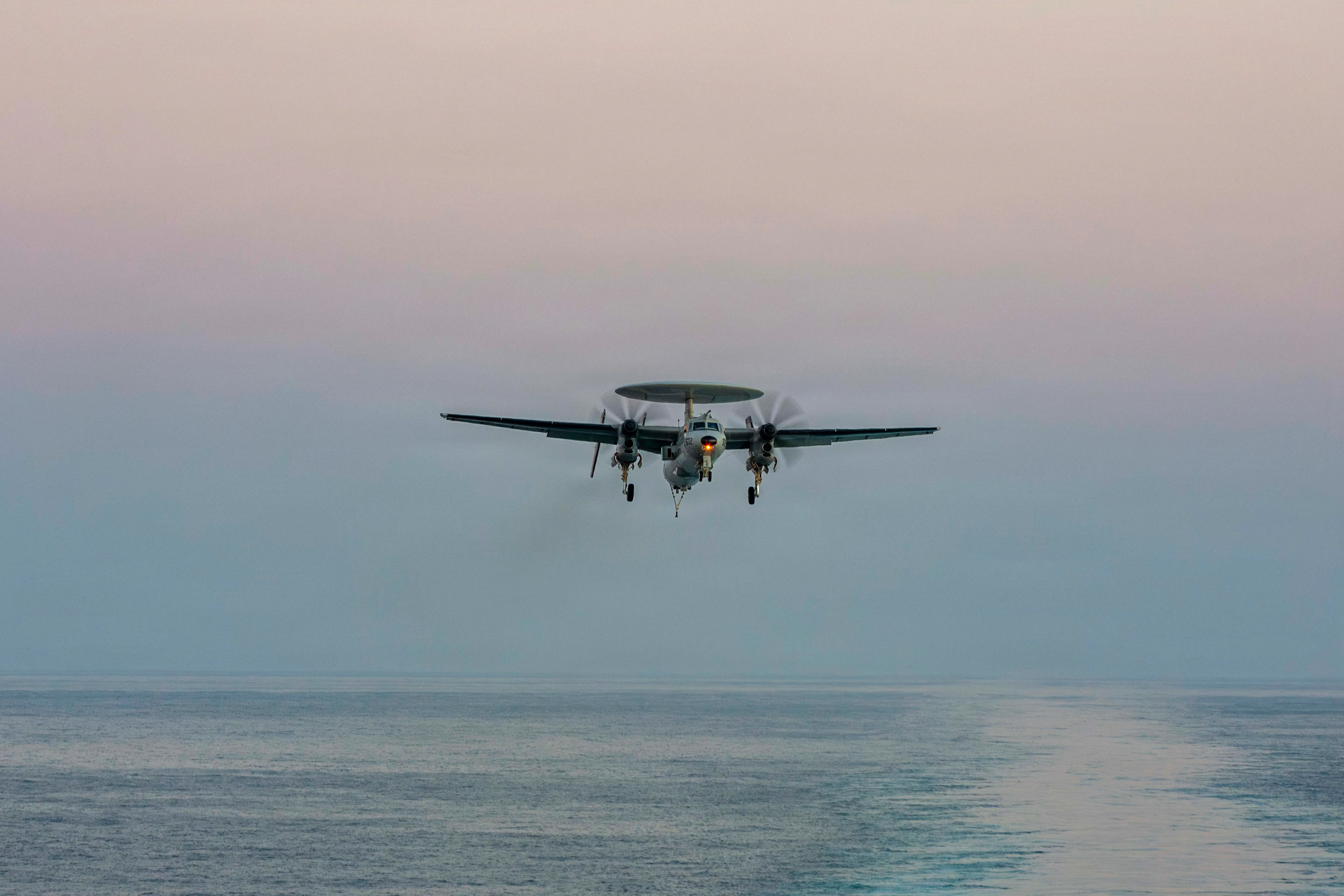 An E-2D Hawkeye, attached to Airborne Command & Control Squadron (VAW) 117, prepares to make an arrested landing on the flight deck of Nimitz-class aircraft carrier USS Abraham Lincoln (CVN 72) in support of Operation Epic Fury, Feb. 28, 2026.