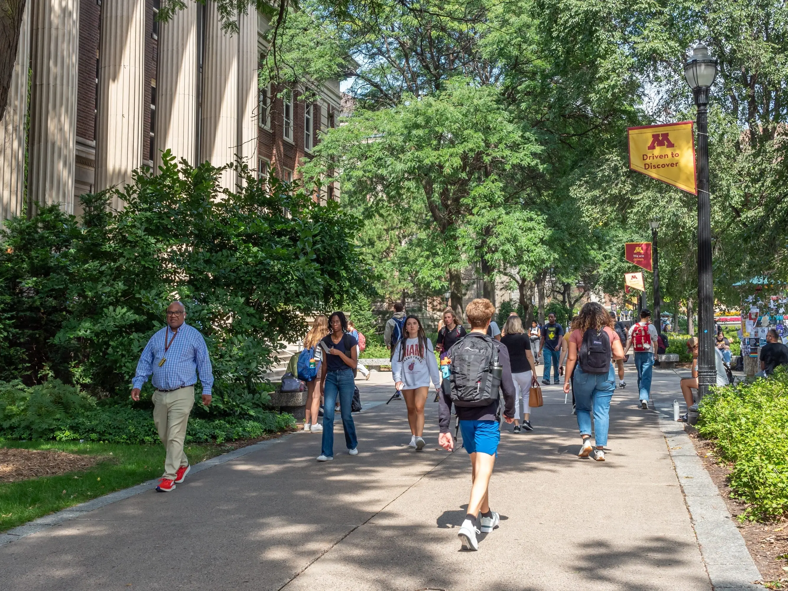 Unidentified individuals at the Northrop Mall on the campus of the University of Minnesota.