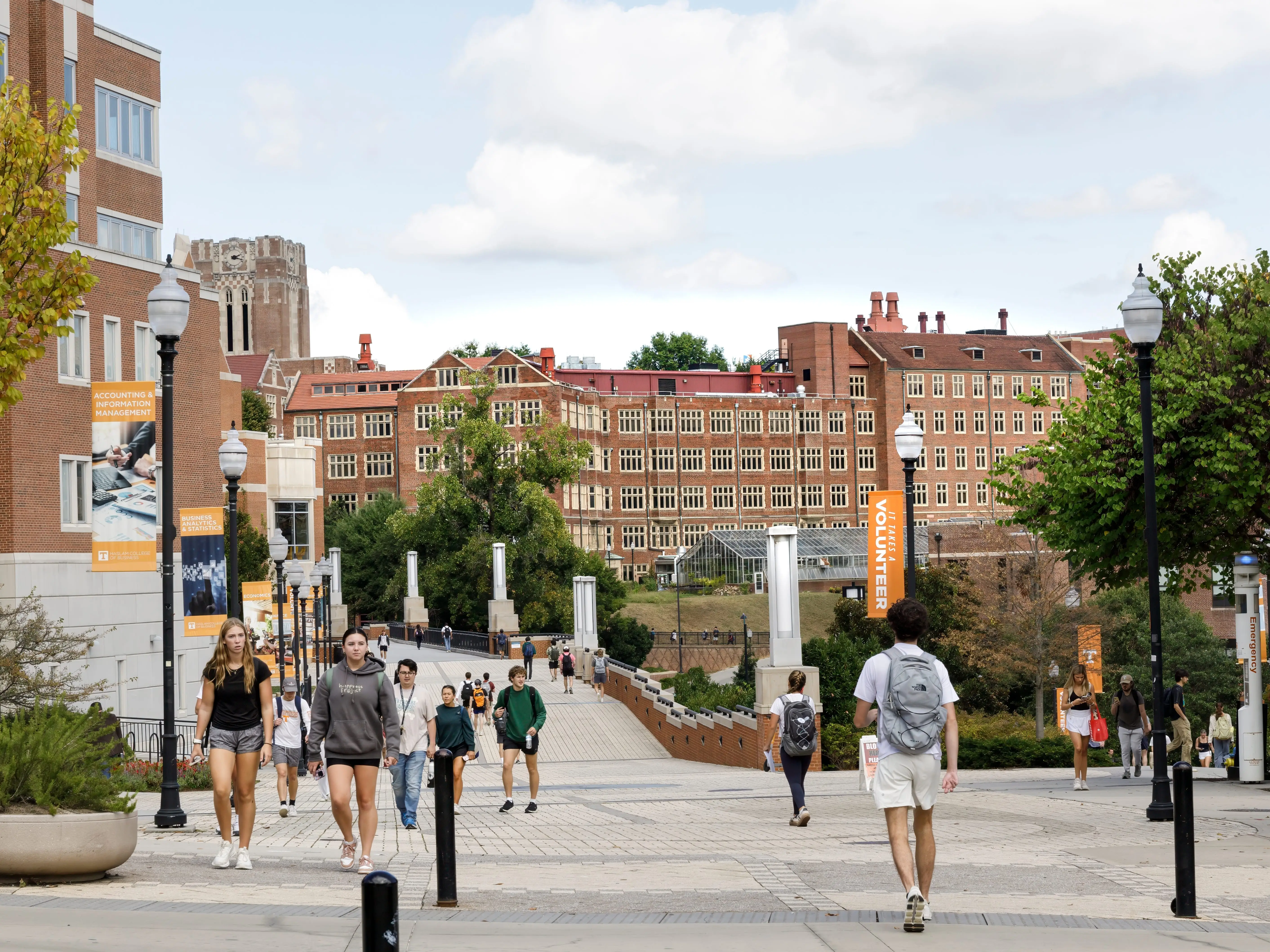 Students walk to and from class on the University campus. The massive Science and Engineering Research Facility looms over the campus.