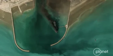 Satellite image shows Iran’s largest naval vessel, a tanker-turned-warship, smoking in port