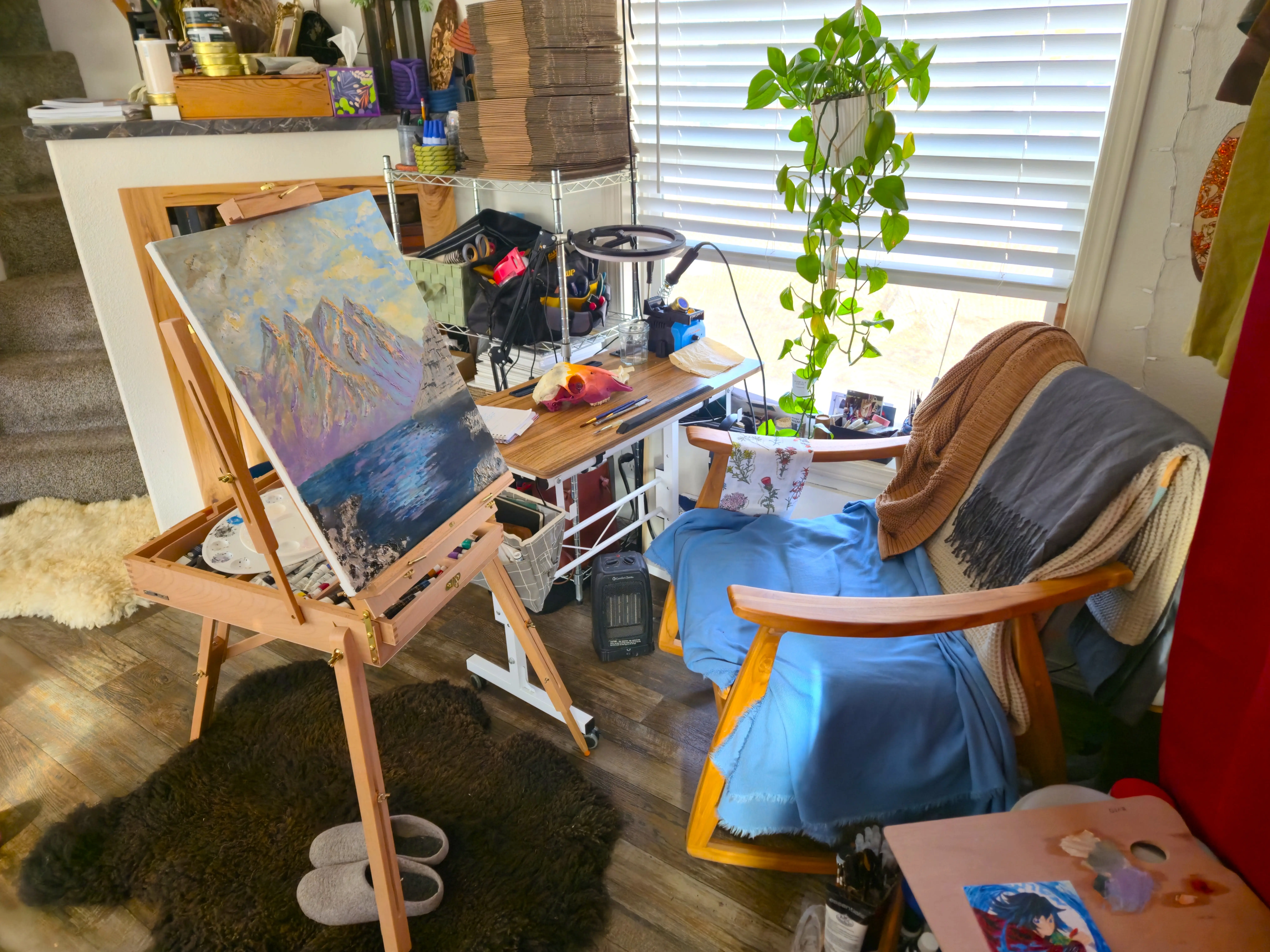 canvas in front of chair next to desk area, window