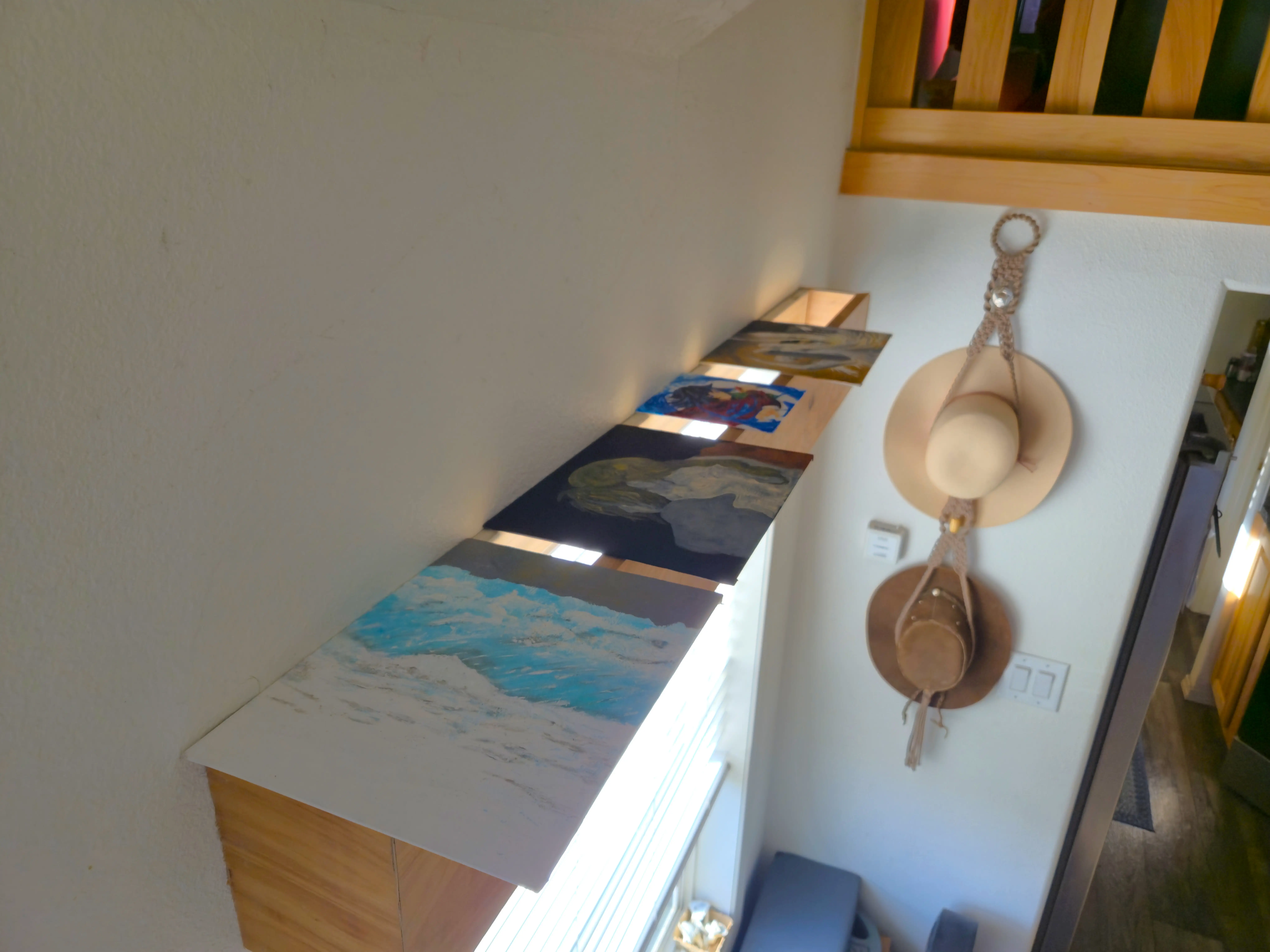 Top of window cornice with artwork resting on top