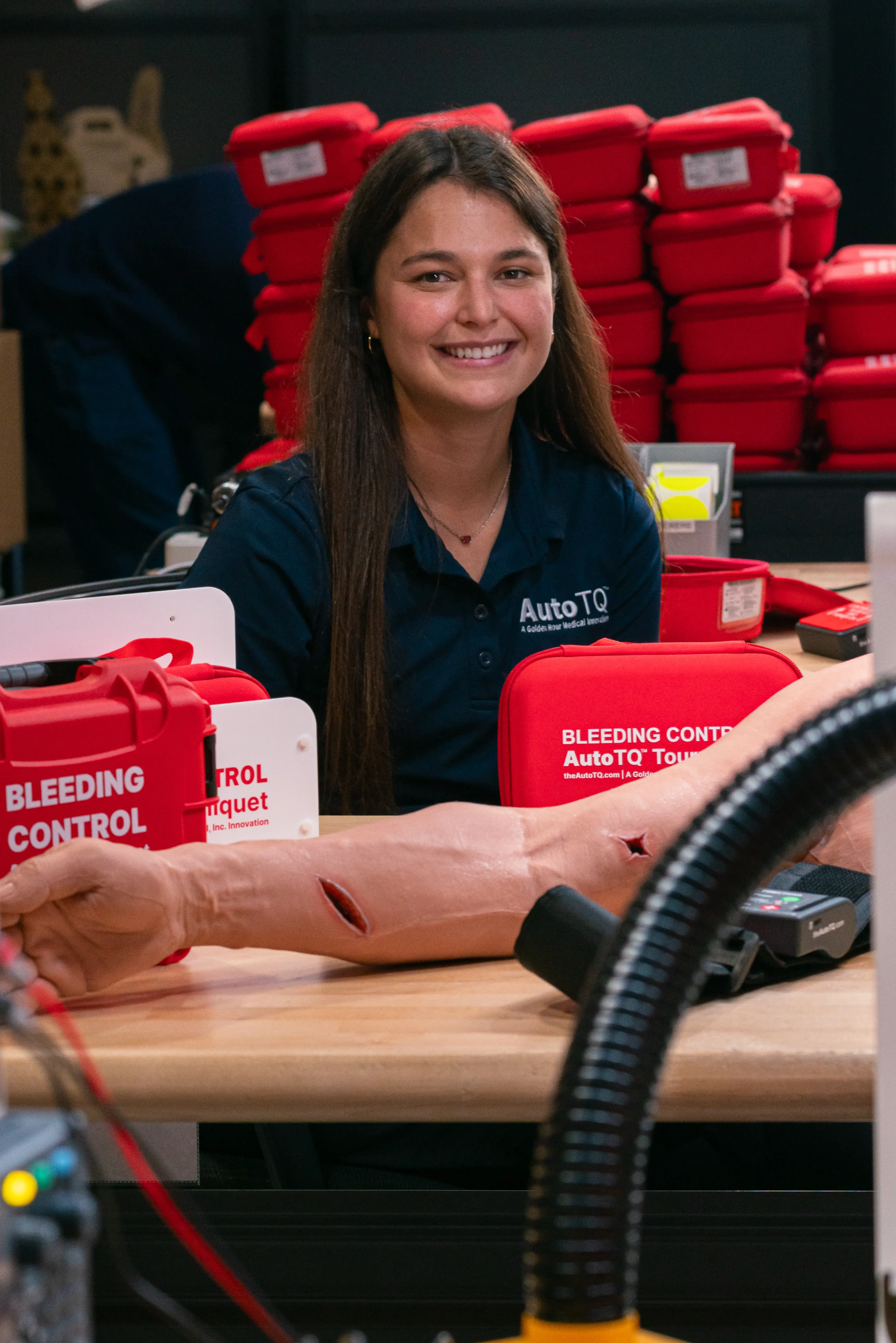 Founder Hannah Herbst with AutoTQ kits at the Golden Hour Medical headquarters in Boca Raton, Florida on March 2, 2026. Herbst developed the AutoTQ automated tourniquet after learning about the frequency of blood loss deaths. (Photo by Jennifer Ortiz)