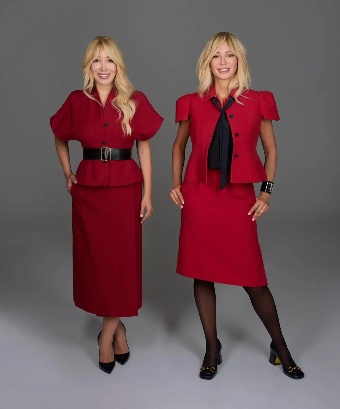 two sisters pose in red for a professional photo