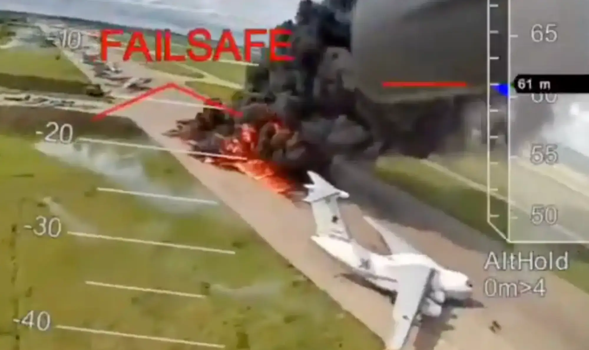 A still from video footage shows a firey explosion beside a grey jet on an airfield with 'Failsafe' written in capital red letters over the footage