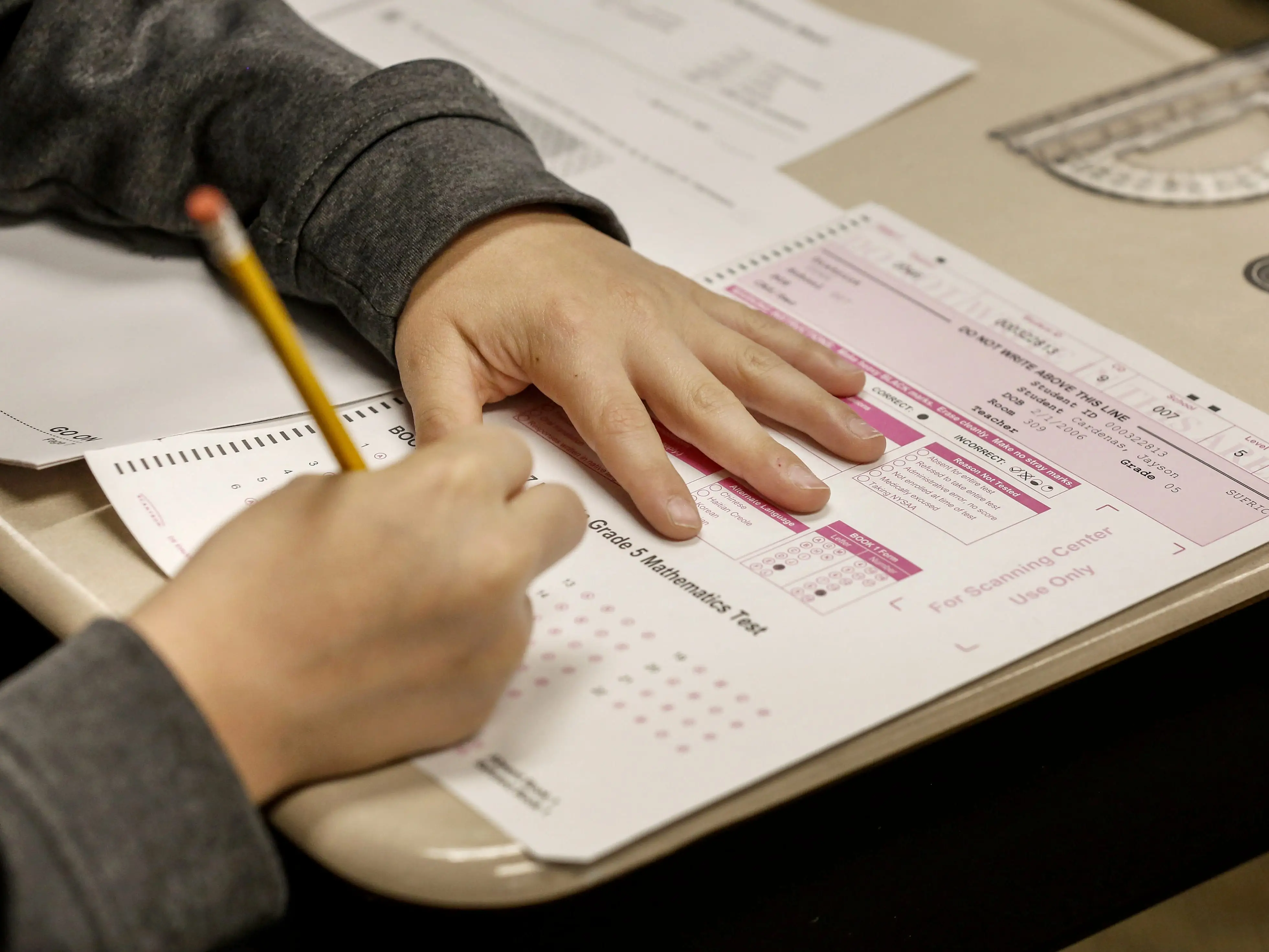 Young student taking paper test