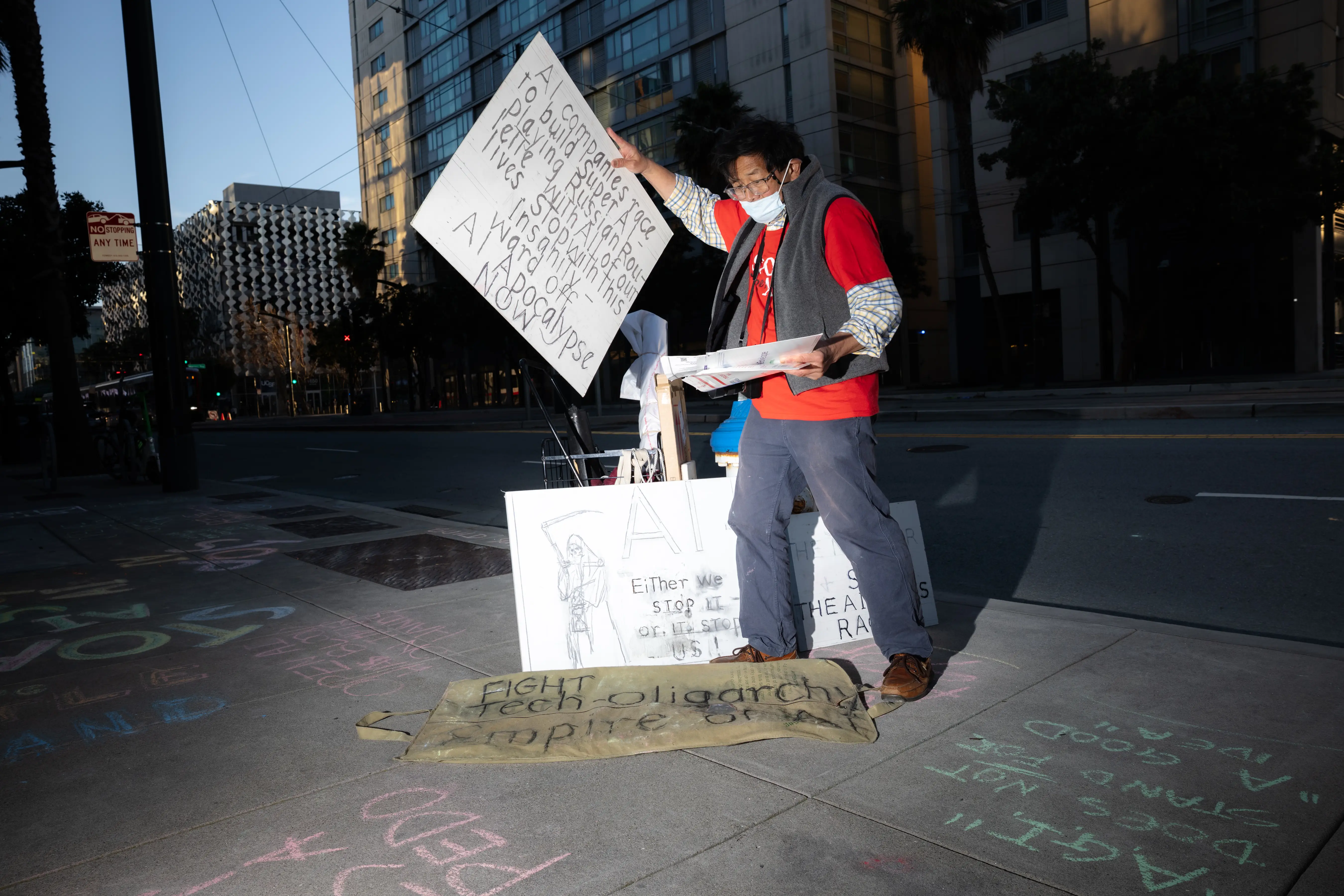 Bill Lo collects the signs he made for the protest against Open AI which took place outside of their headquarters in San Francisco.