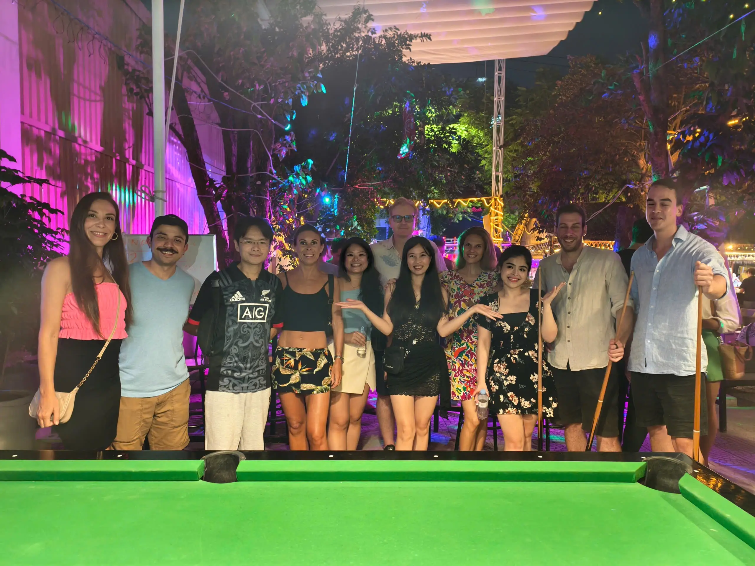 Group of people playing pool in Da Nang, Vietnam.