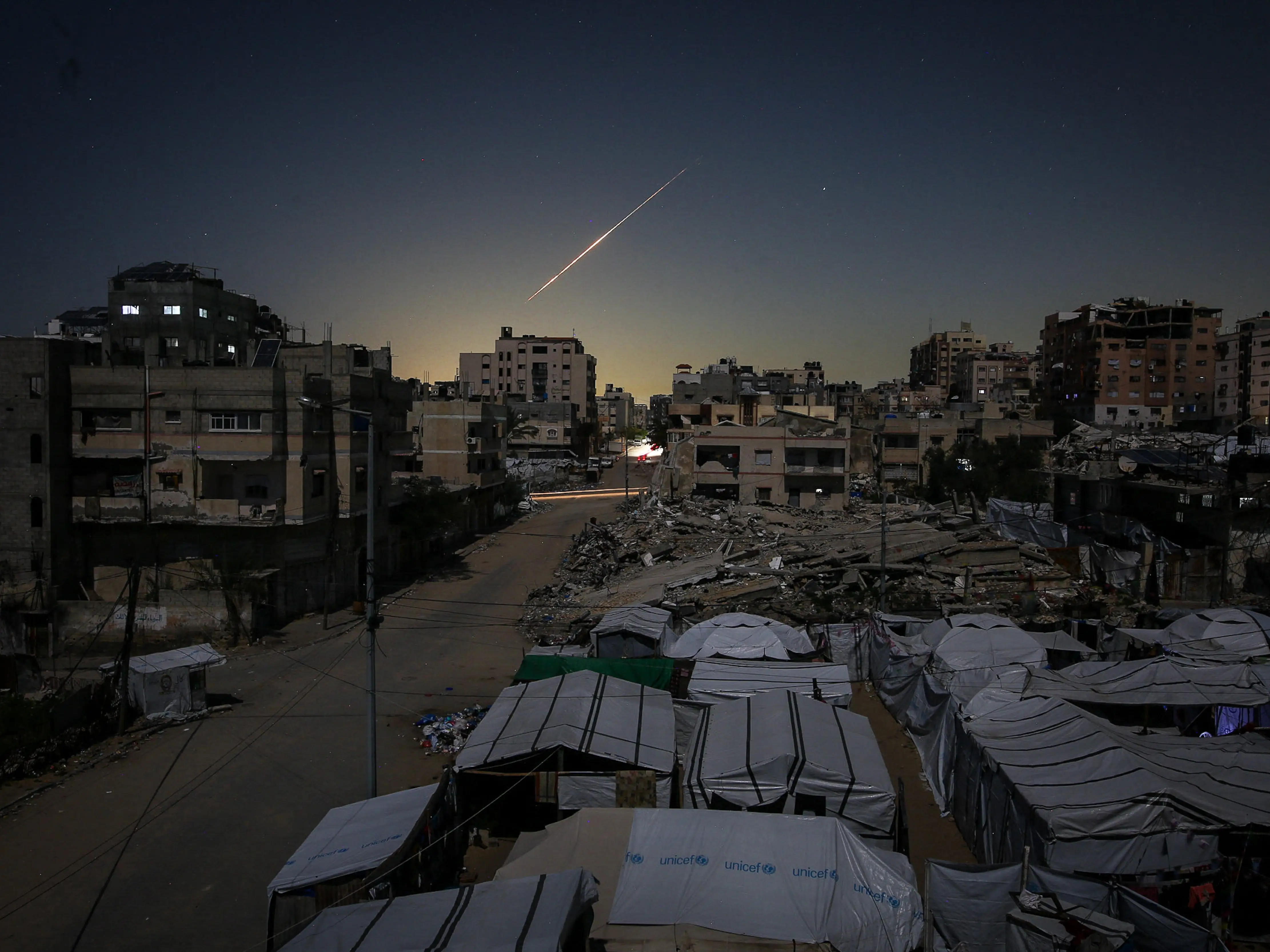 Iranian rockets heading toward Israel are seen crossing the sky over Gaza City on March 3, 2026, as they travel toward Israeli territory amid escalating regional tensions.