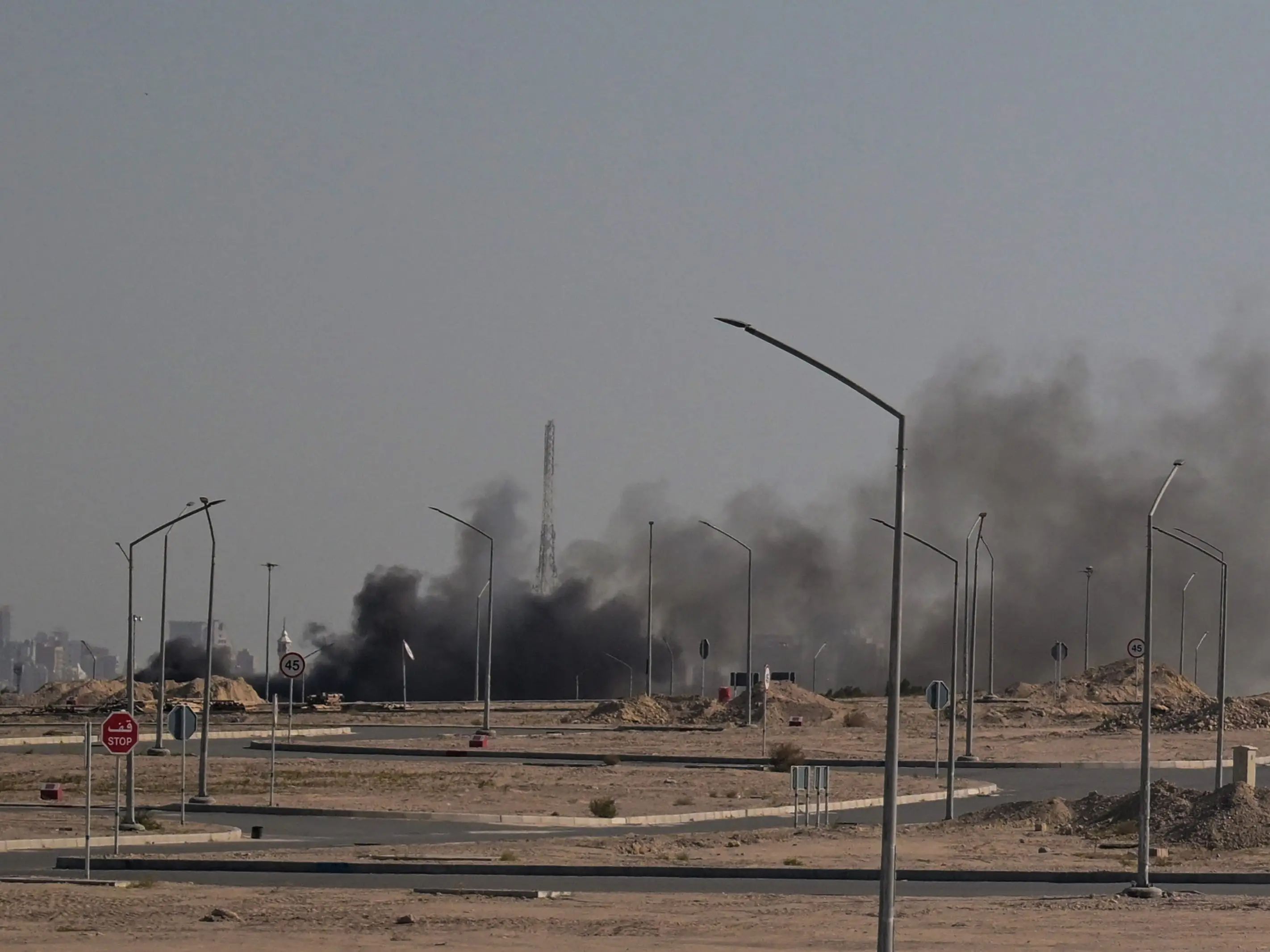 Smoke rises from a reported Iranian strike in the area where the US Embassy is located in Kuwait City on March 2, 2026. Black smoke was seen rising from the US embassy in Kuwait City on March 2 after the latest volley of Iranian strikes, an AFP correspondent saw.