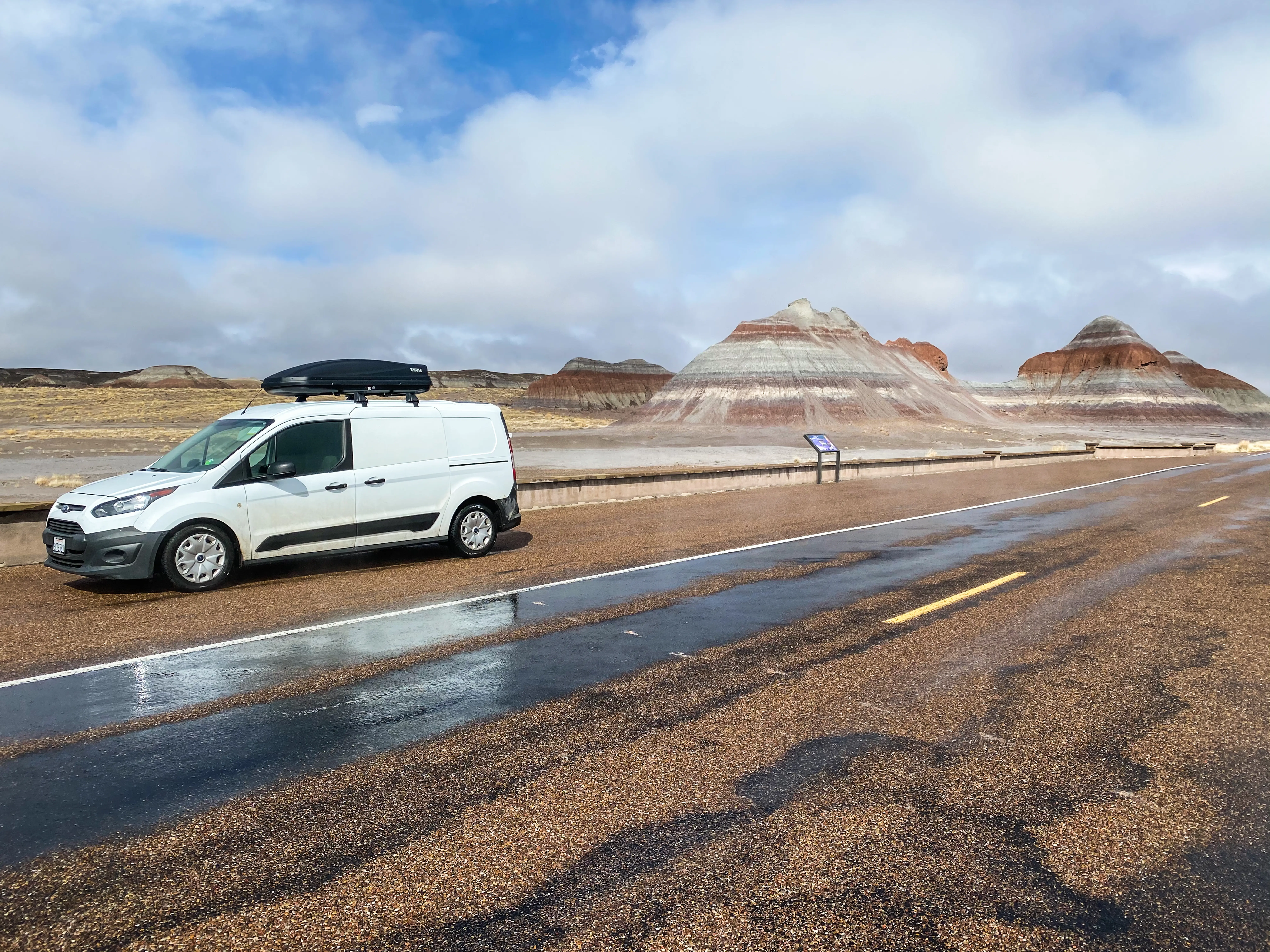 Van parked near Teepees Petrified Forest