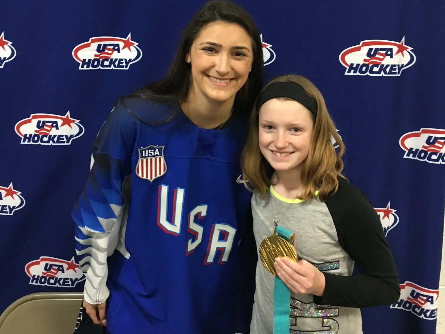 The authors daughter poses with Olympic Gold medalist Megan Keller after her win at the 2018 Olympics/