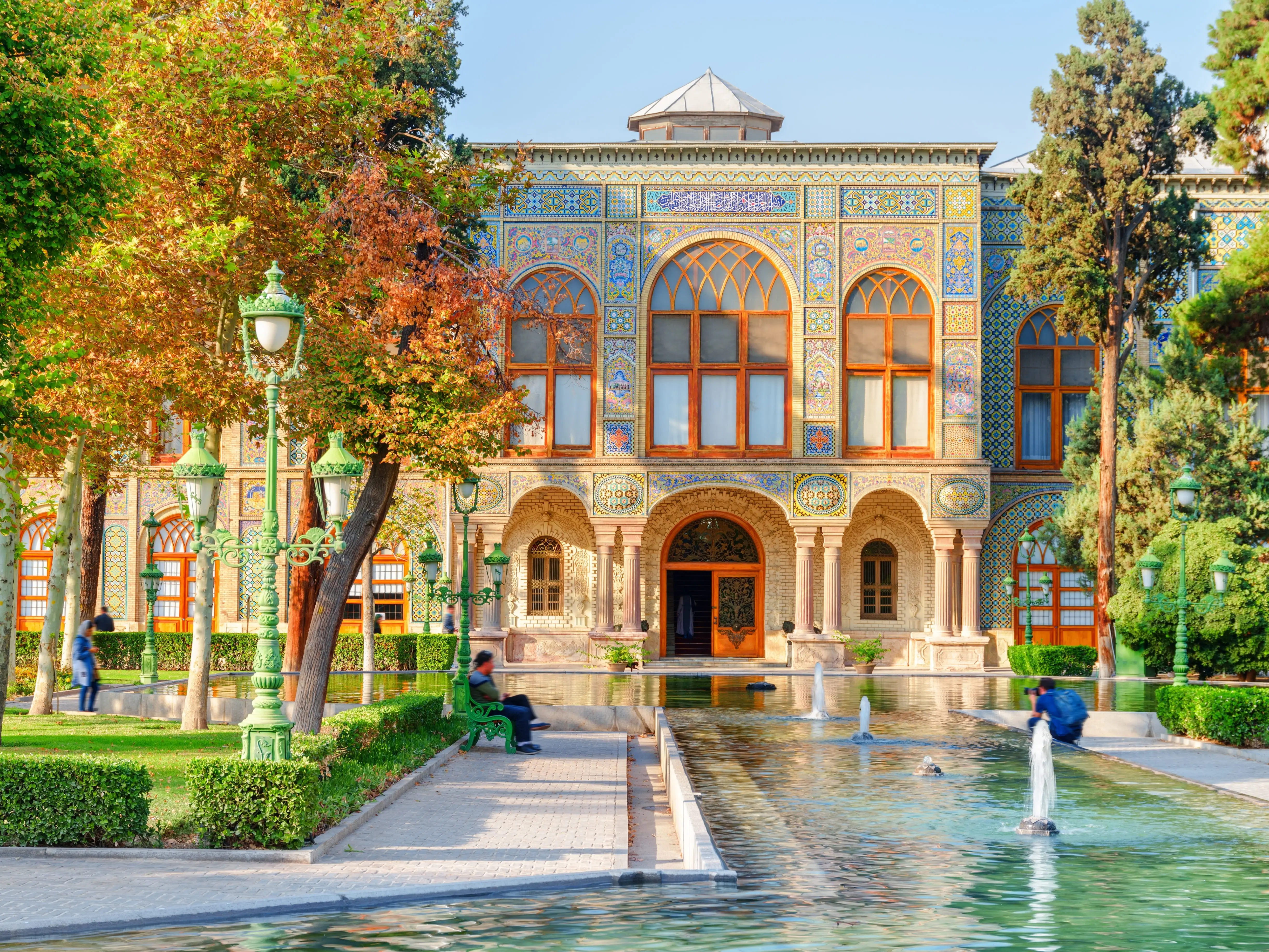 Beautiful view of the Golestan Palace and scenic fountains among gardens in Tehran, Iran. The Golestan Palace is a popular tourist attraction of the Middle East. Traditional Persian exterior.