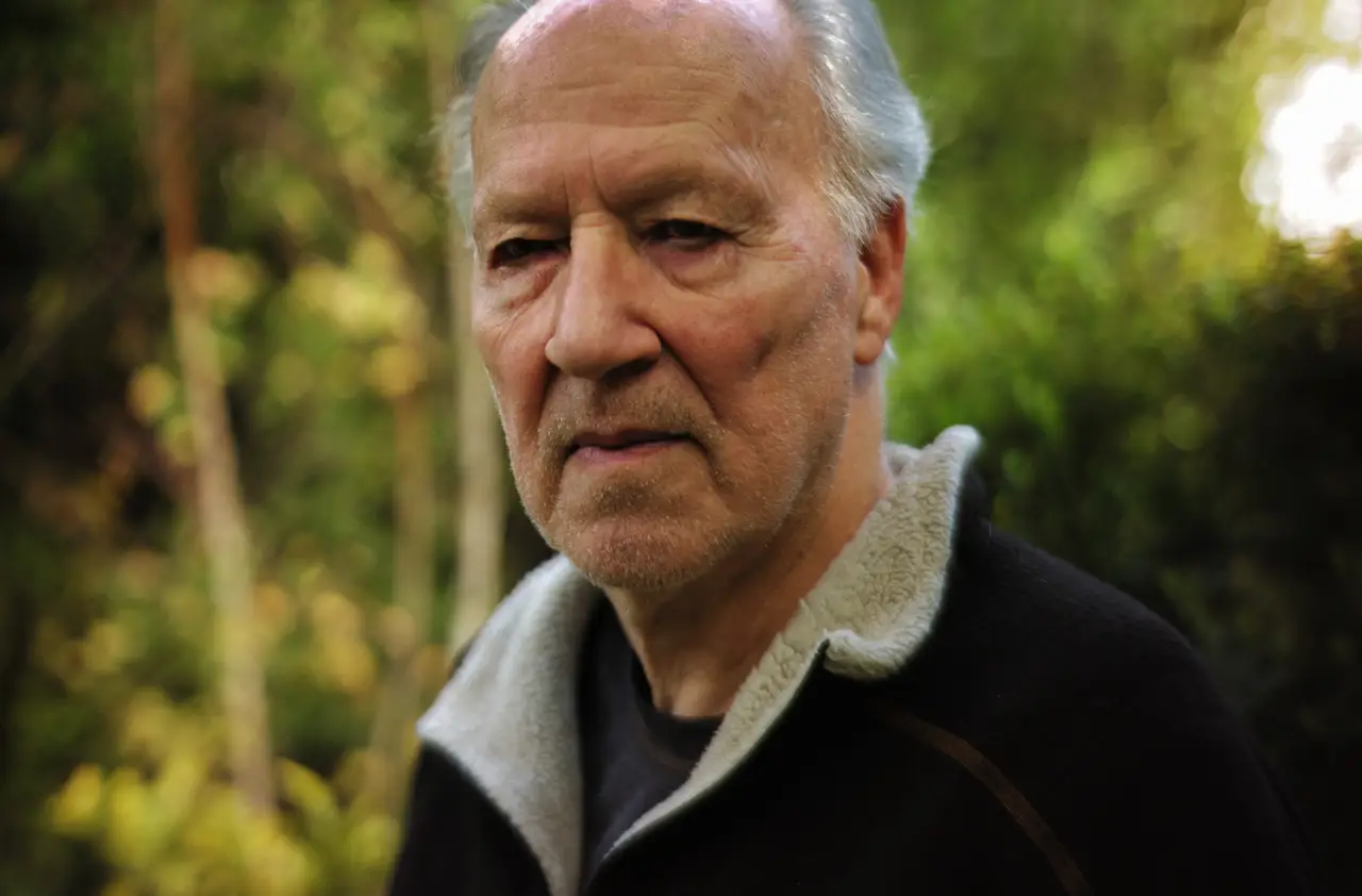 Werner Herzog with forest in the background