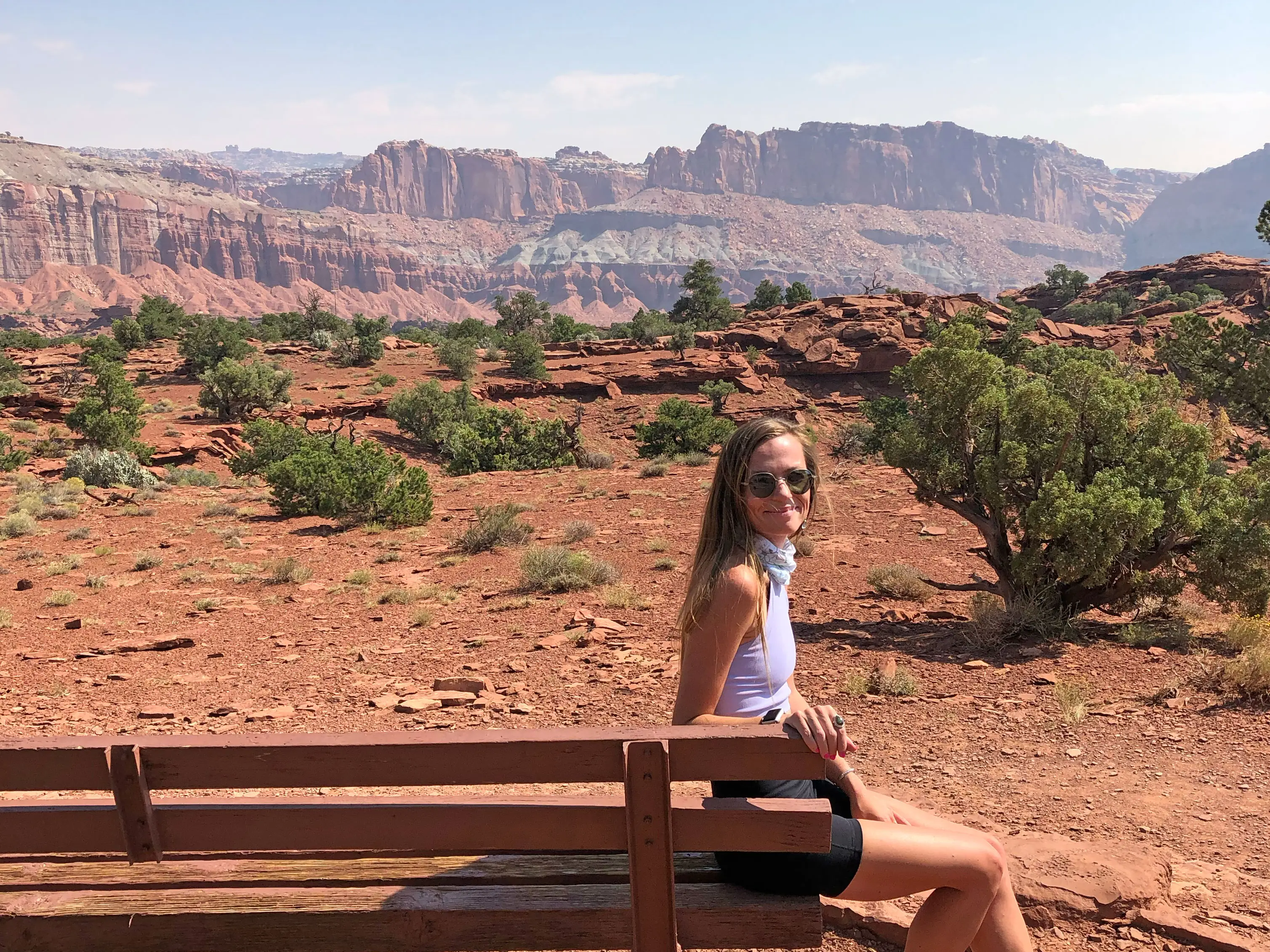 Emily sits on a bench in Capitol Reef National Park.