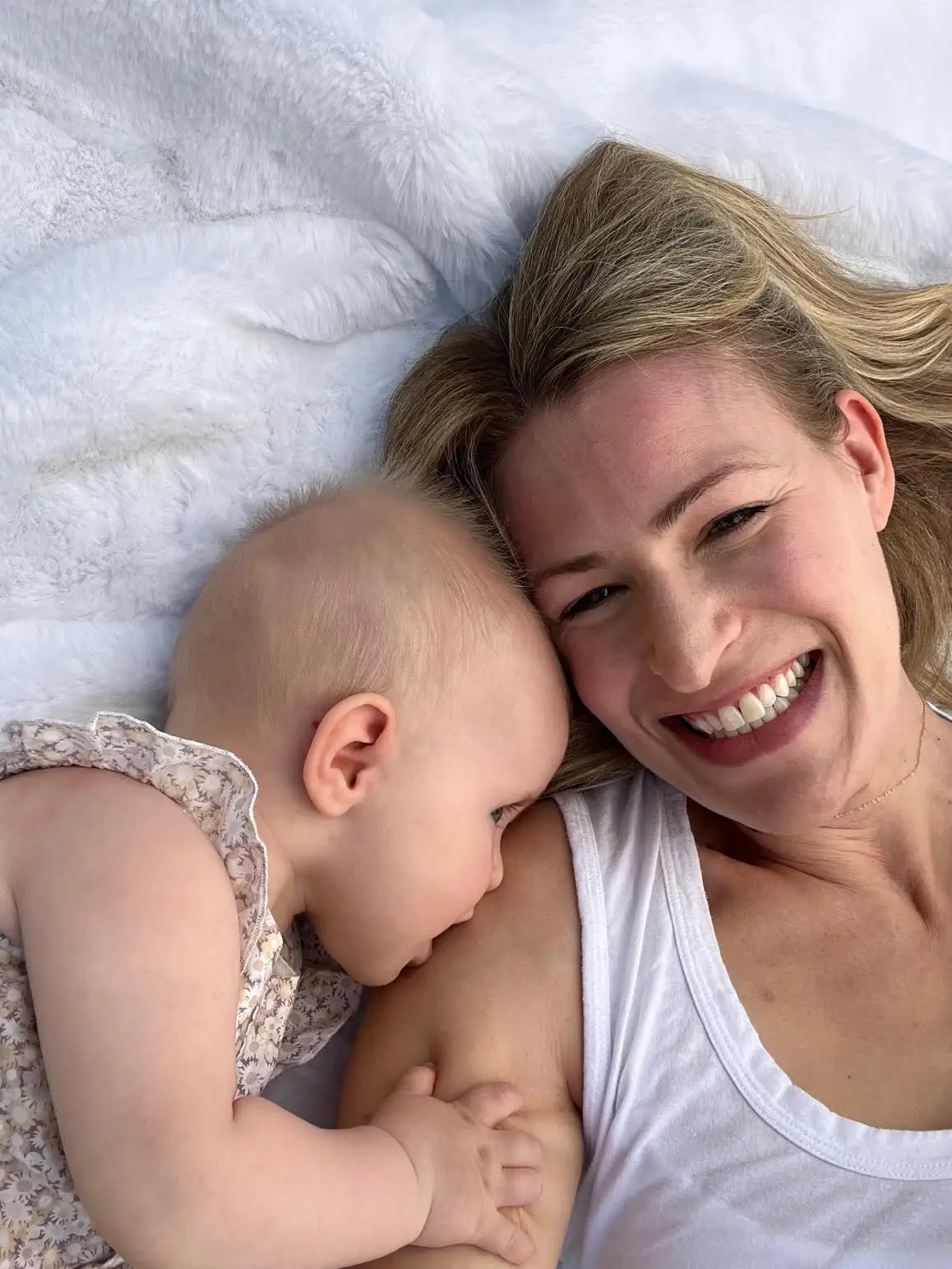 laura smiling, with newborn, before diagnosis