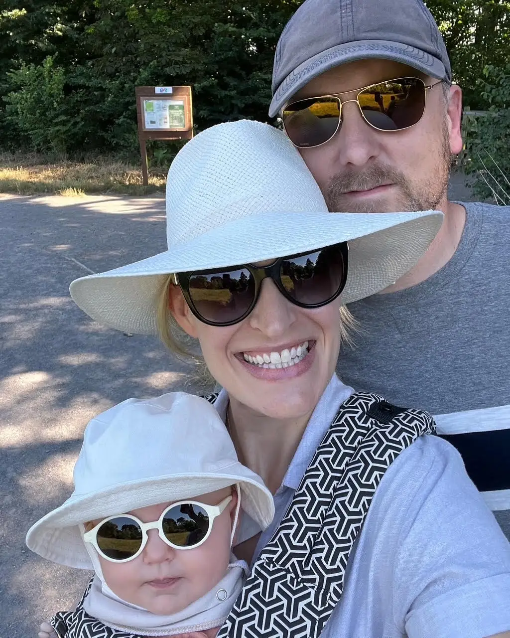 laura with baby and husband, before diagnosis