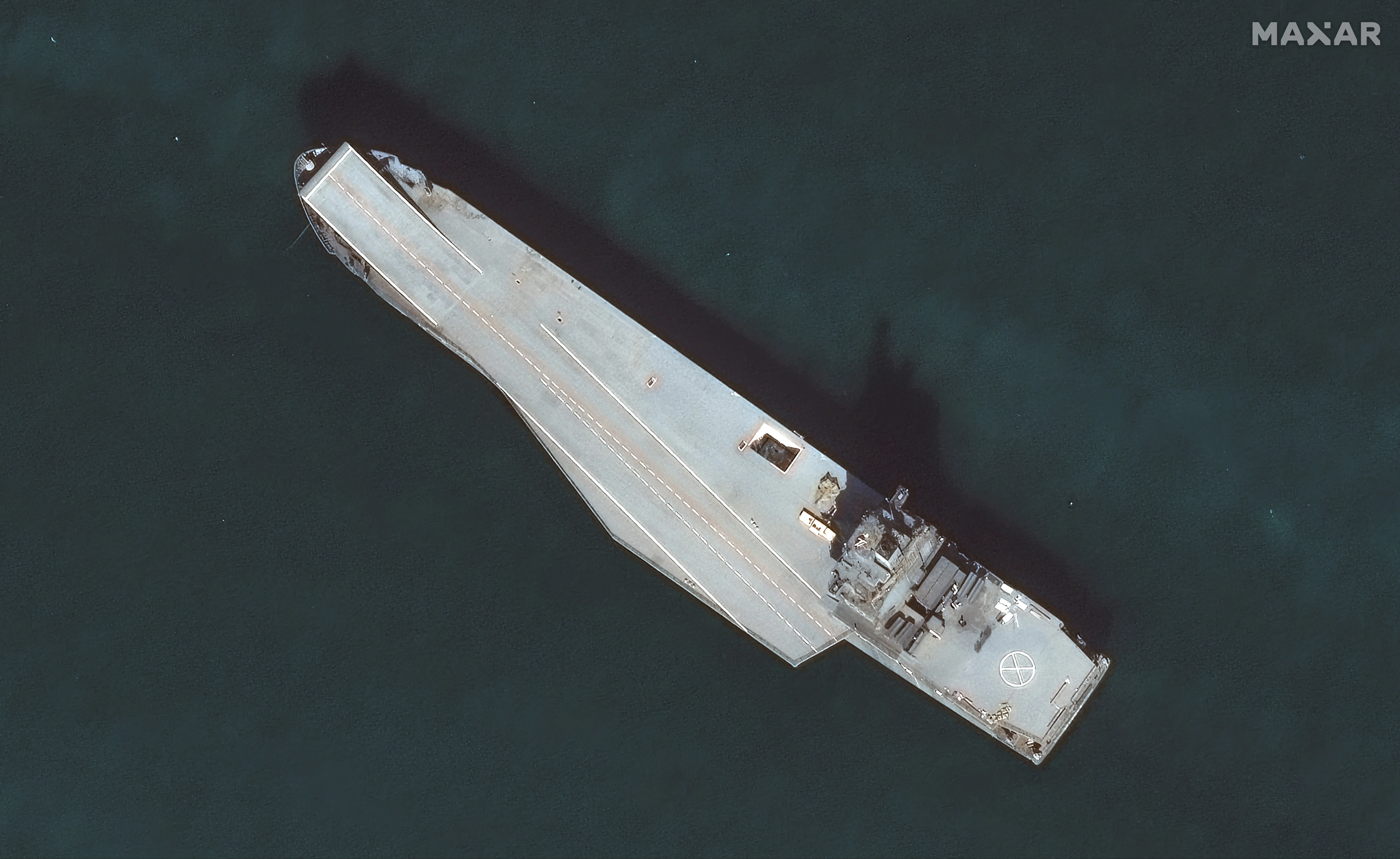 Maxar satellite imagery of Iran's drone carrier taken in ahead of its commissioning into the Iranian naval forces.