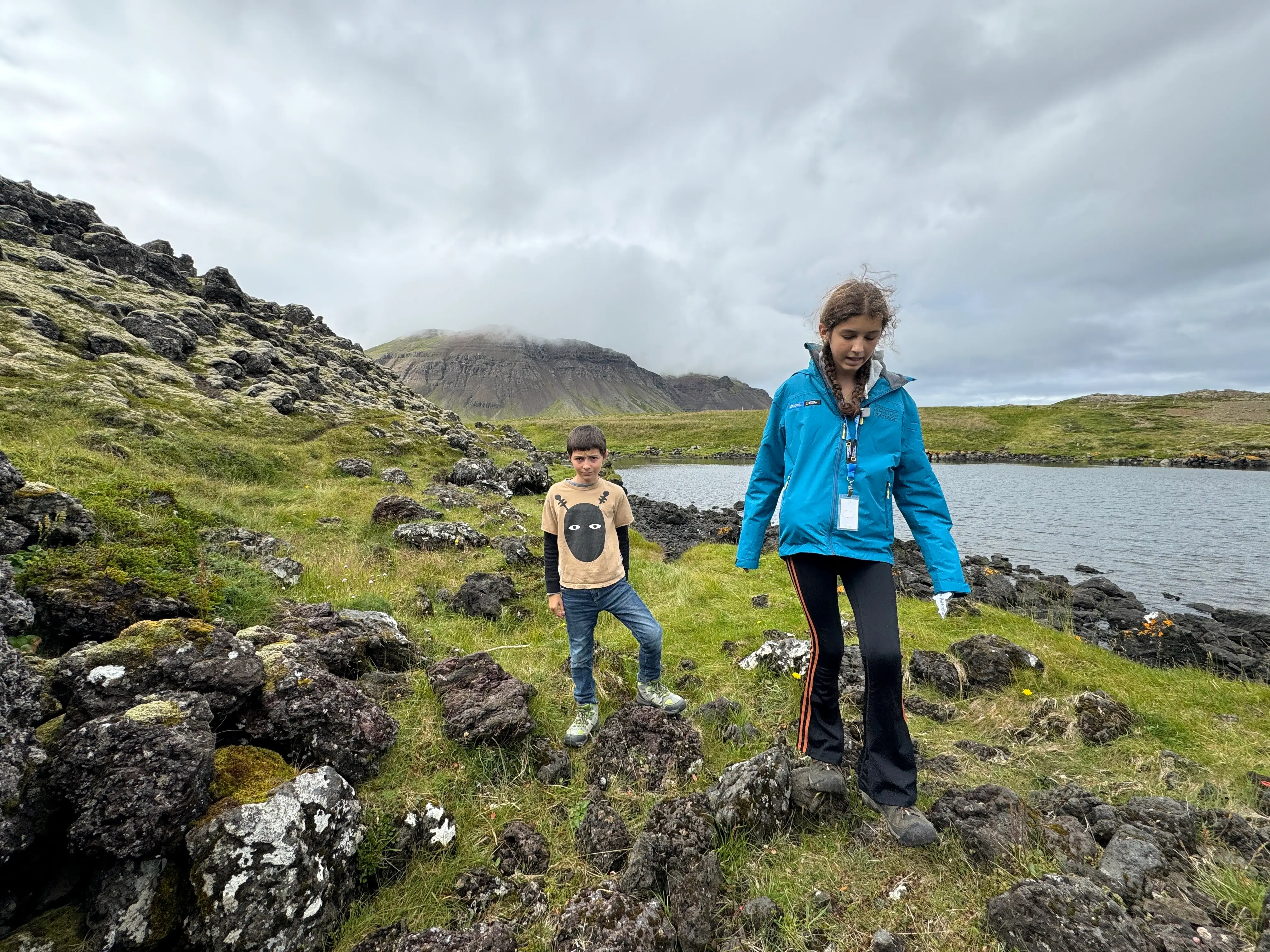 The author's children hike along the water.