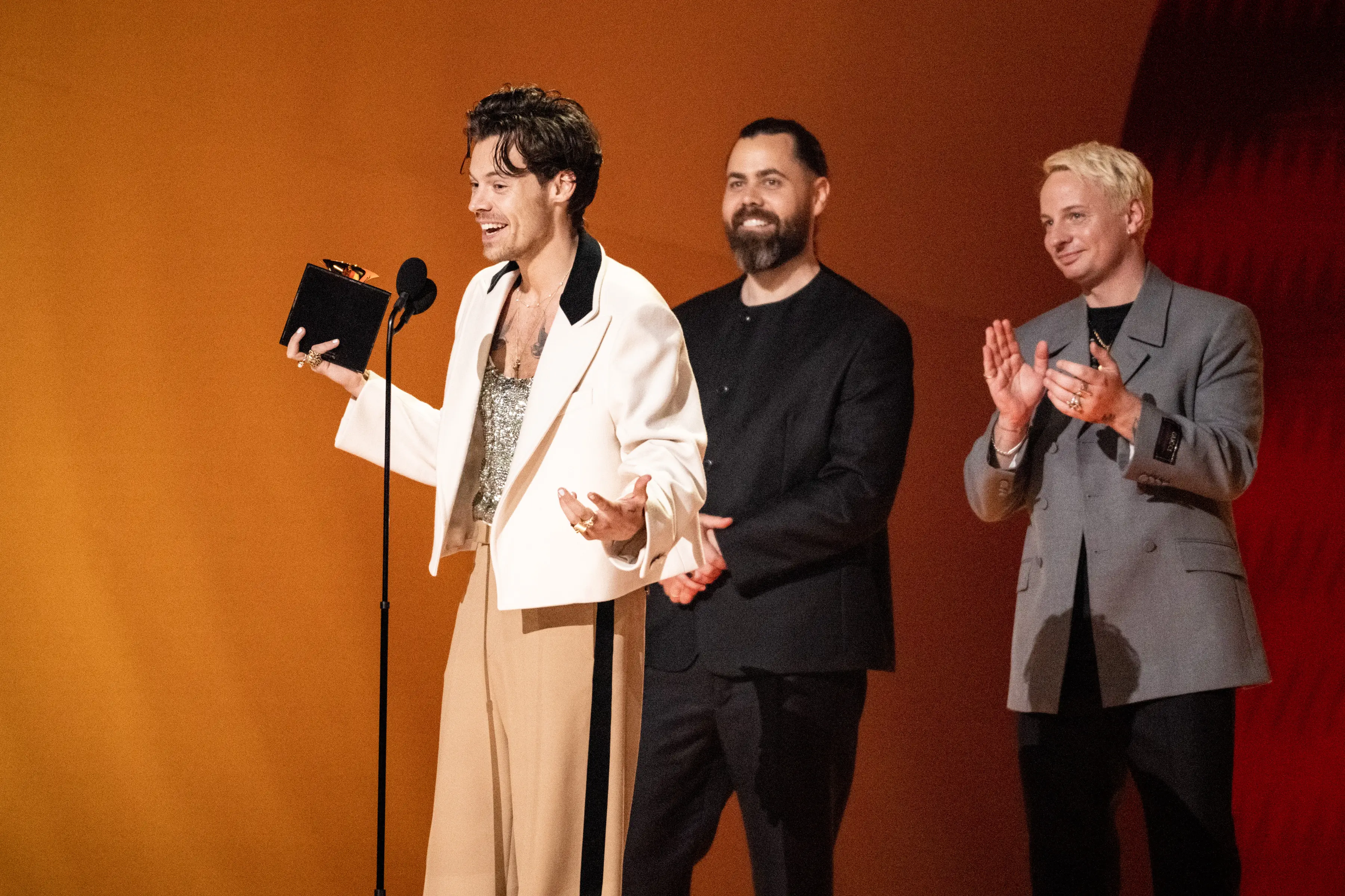 Harry Styles, Tyler Johnson, and Kid Harpoon accept album of the year for 