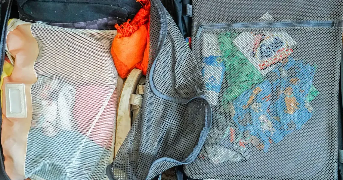 I took a 7-day cruise with carry-on luggage and a backpack. See everything on my packing list and how I organized it all.