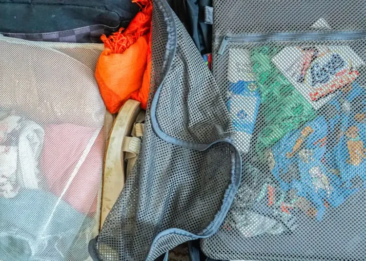 I took a 7-day cruise with carry-on luggage and a backpack. See everything on my packing list and how I organized it all.
