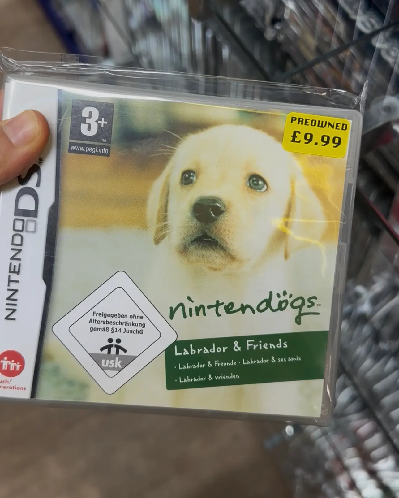 DS Nintendo Nintendogs Labrador & Friends game held in hand.