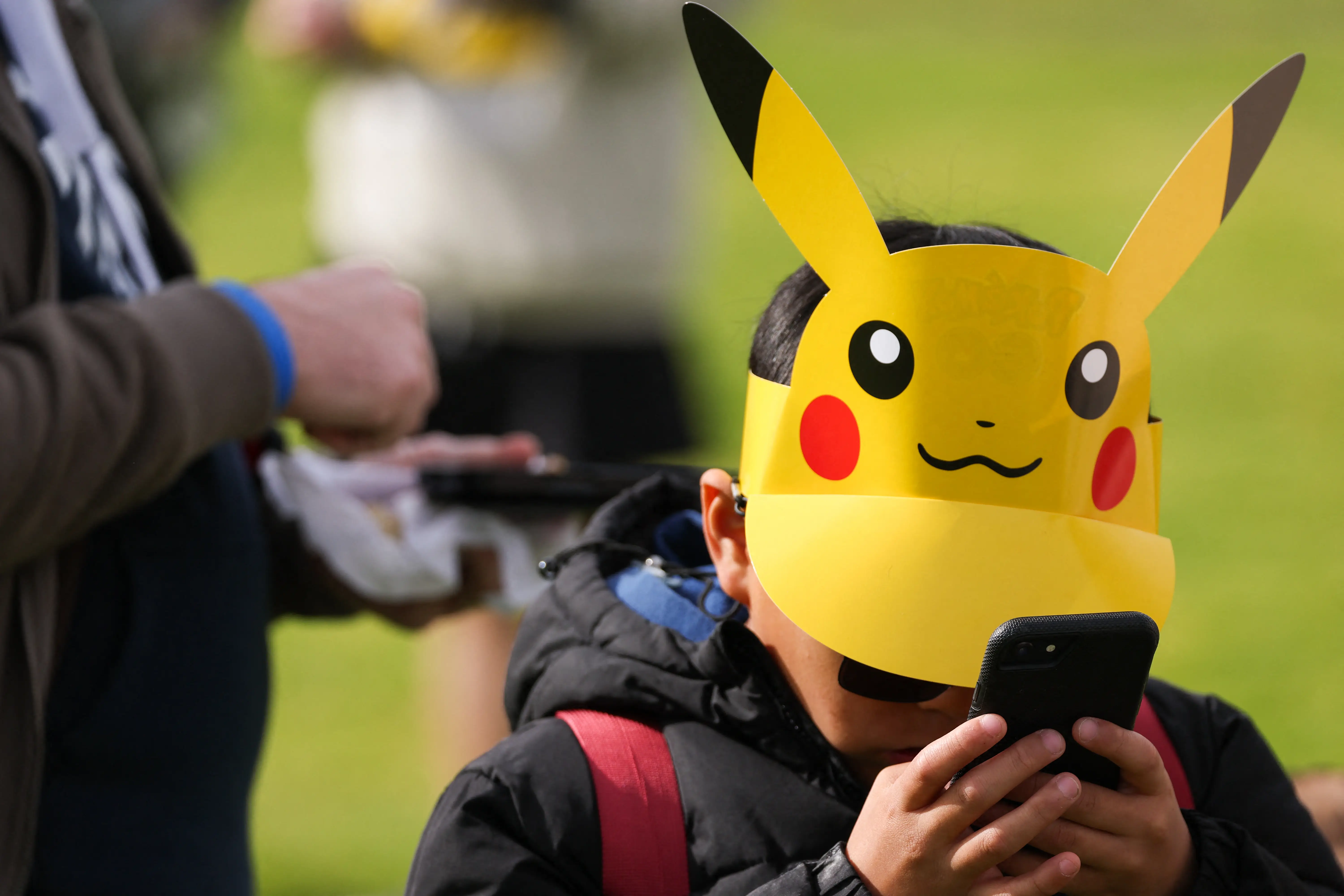 kid in pikachu hat