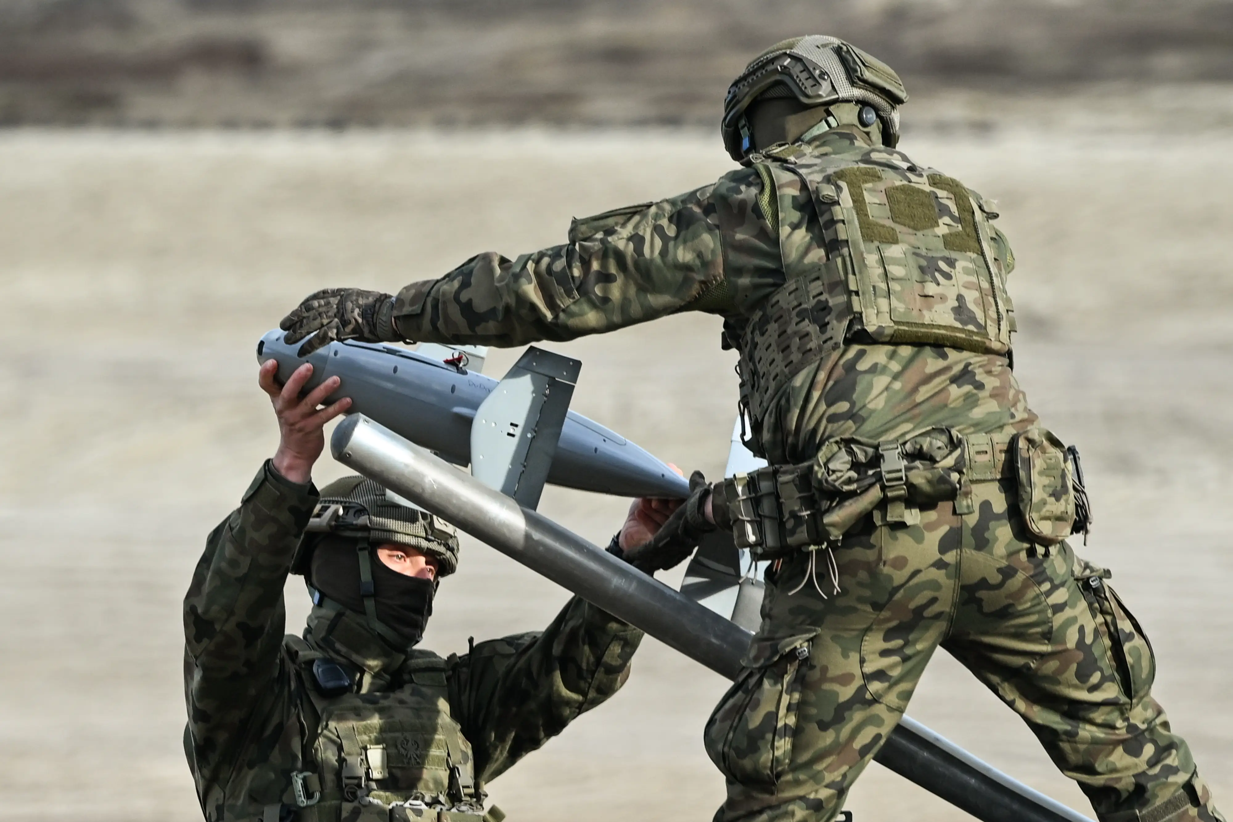 Two soldiers prepare the AS3 Surveyor interceptor.