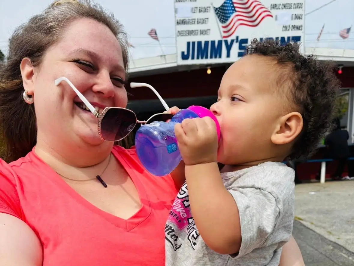 A woman holding a toddler.