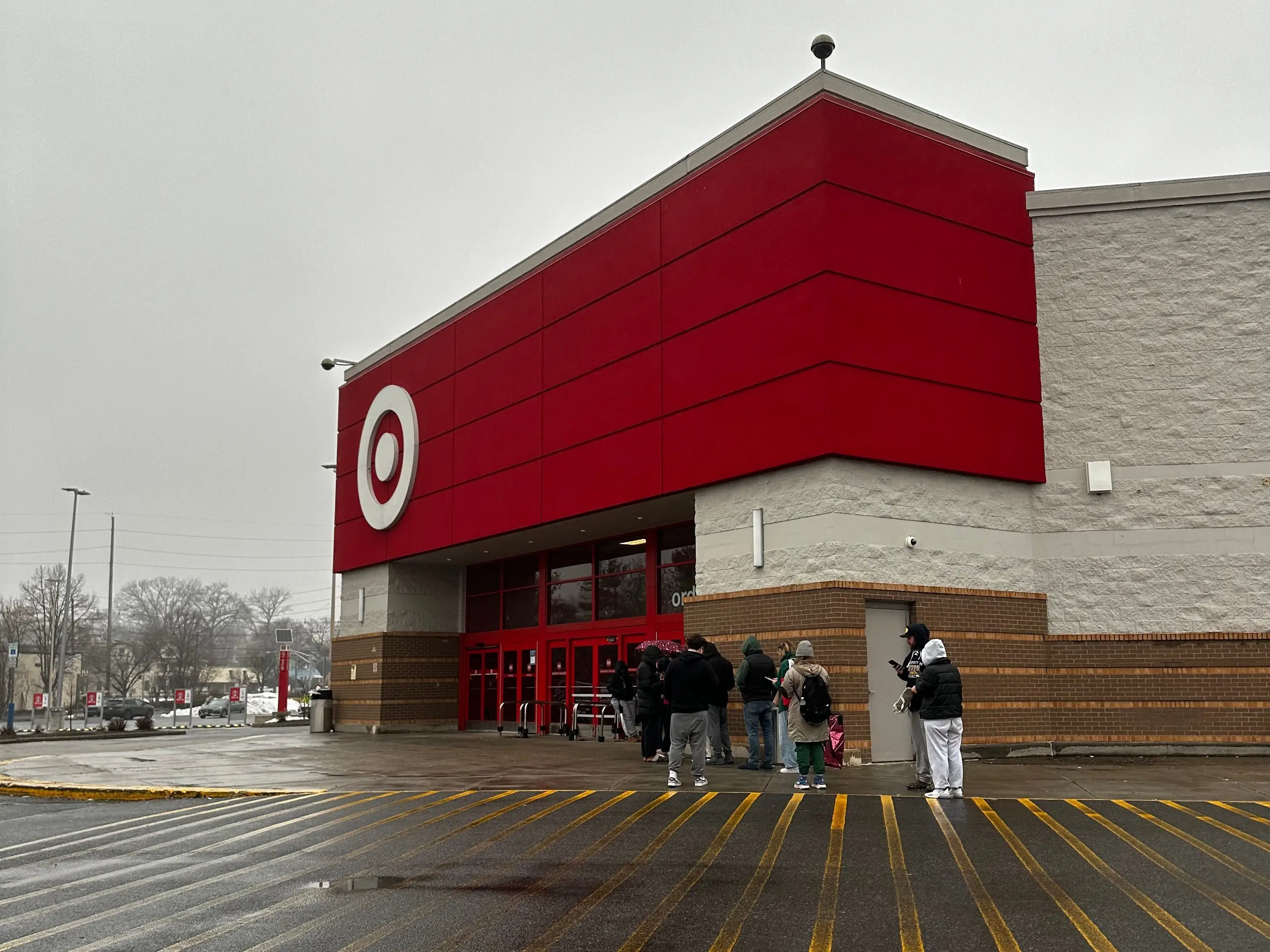 Shoppers wait outside a Target store to shop the Roller Rabbit collaboration line.