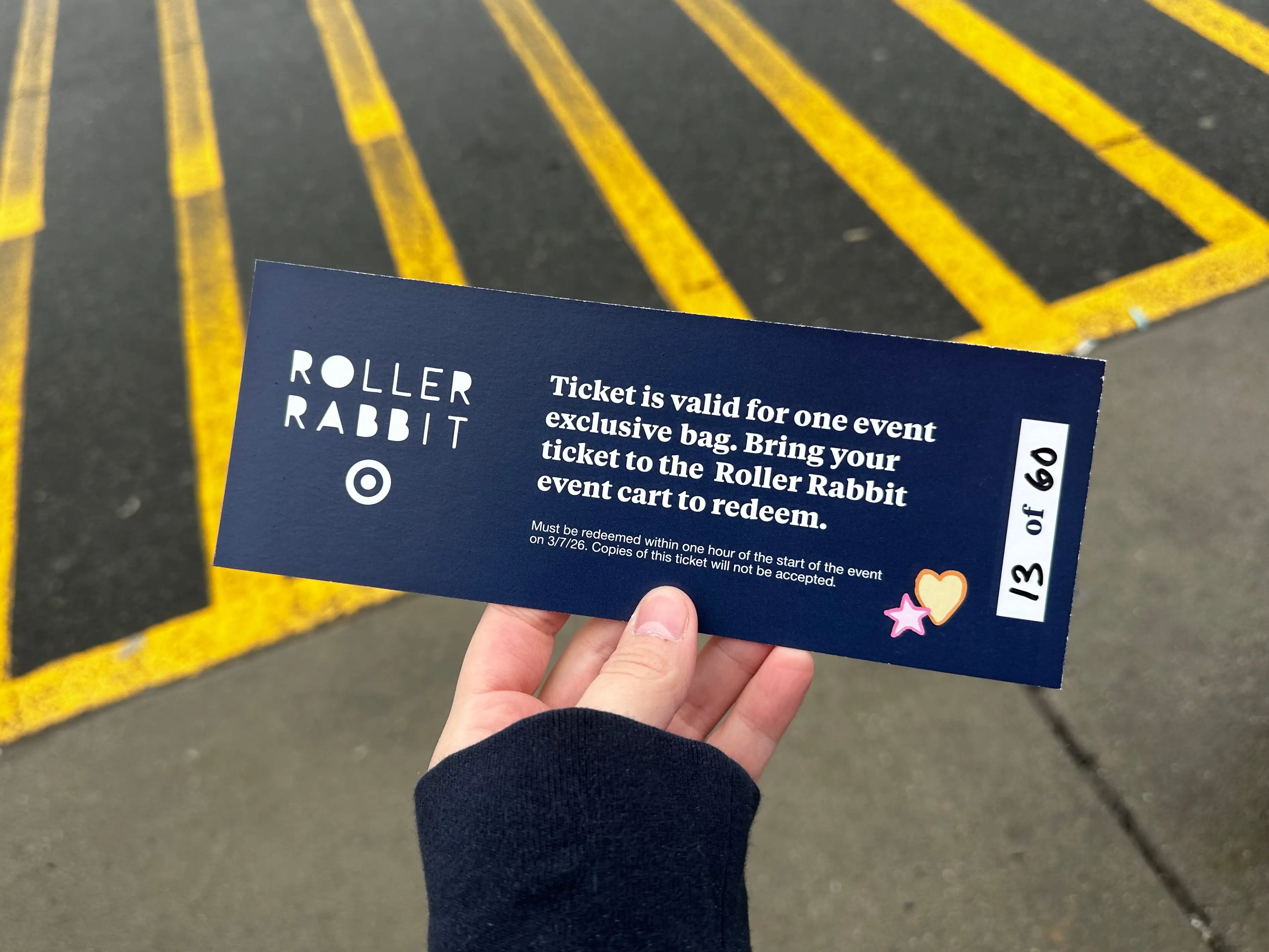 A ticket to redeem a free Roller Rabbit shopping bag at Target.