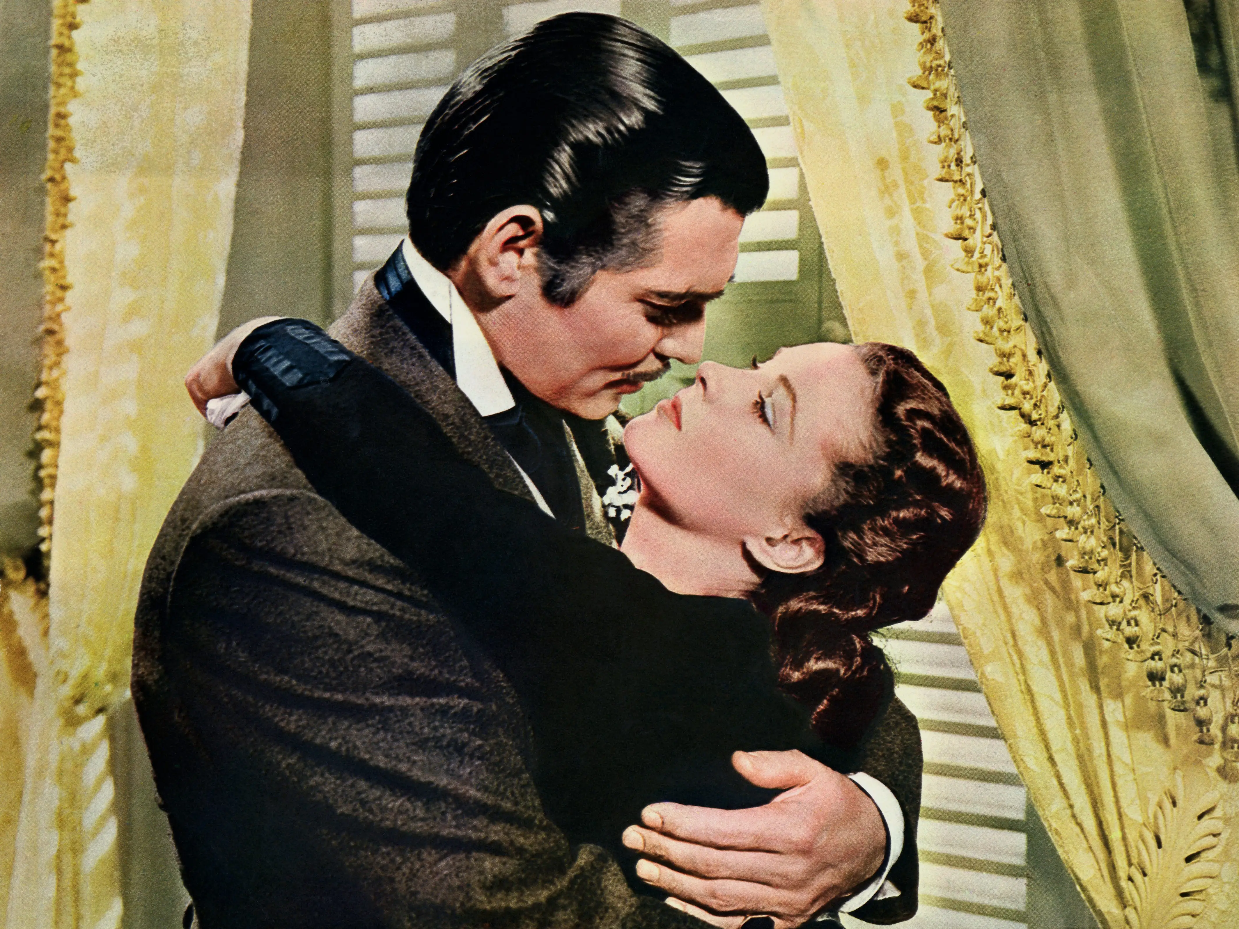 Rhett Butler embraces Scarlett O'Hara (Vivien Leigh) in 