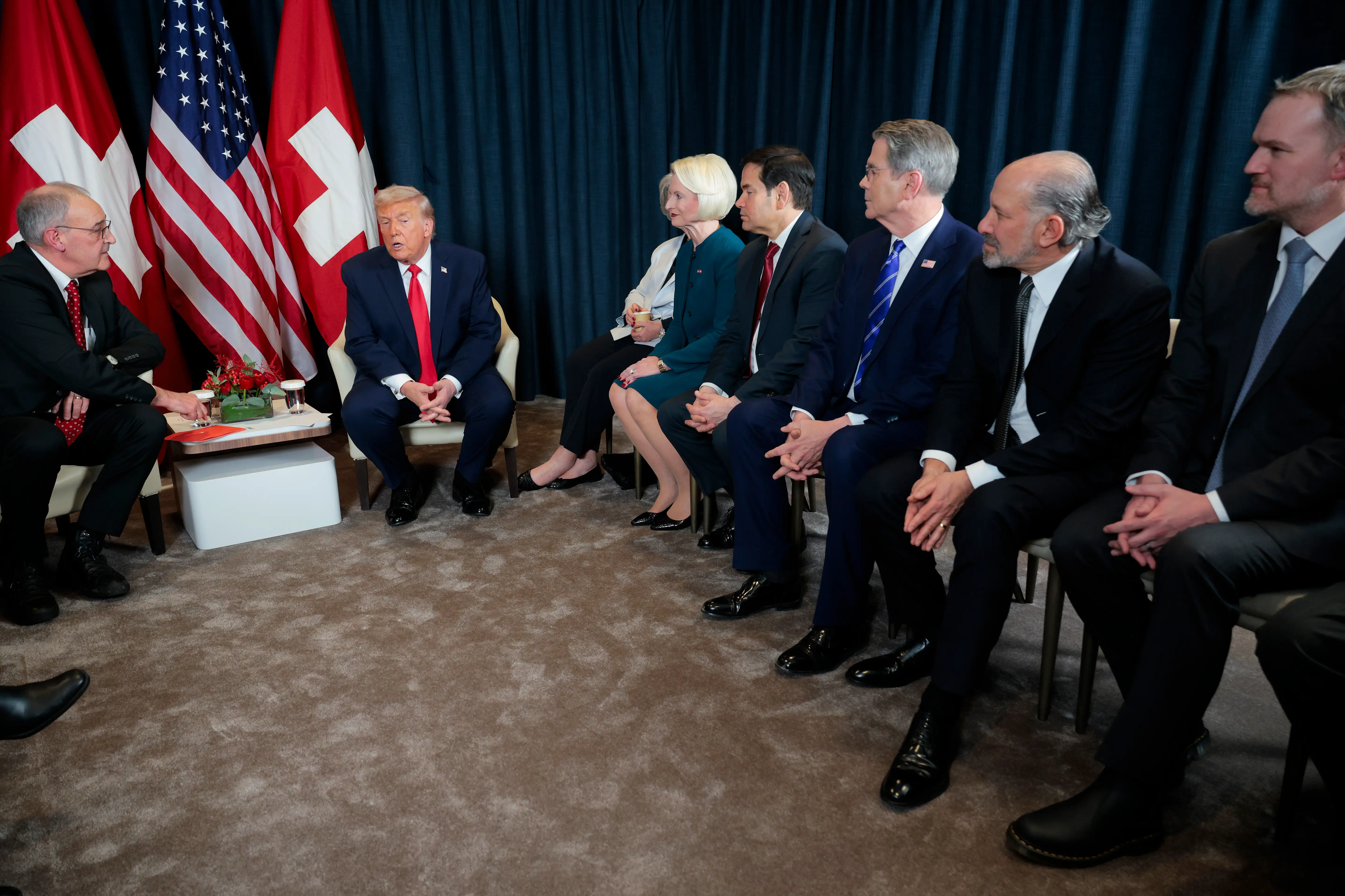 President Donald Trump sits at Davos with members of his cabinet, including Marco Rubio, Scott Bessent, and Howard Lutnick.