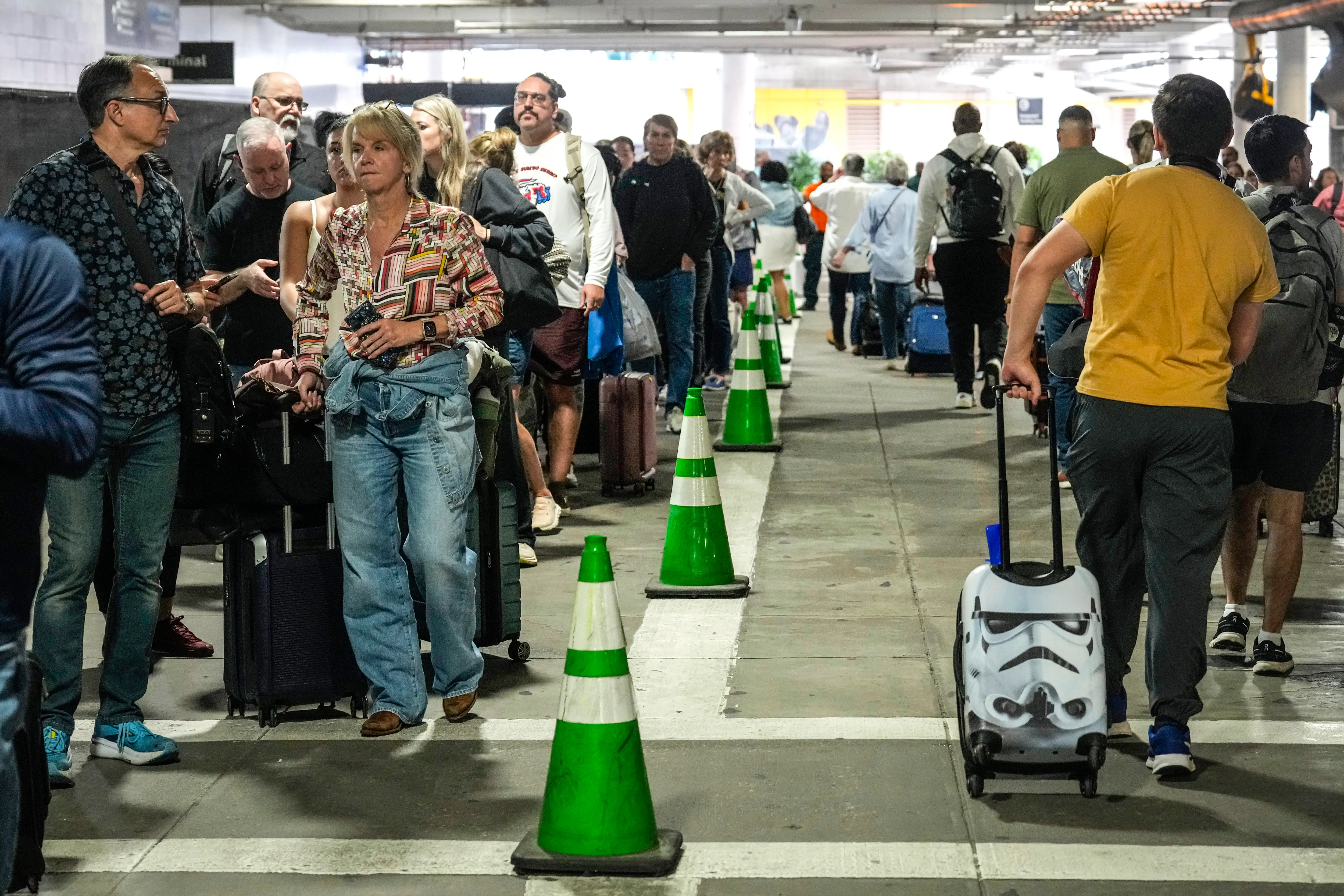 Passengers line up outside airports.