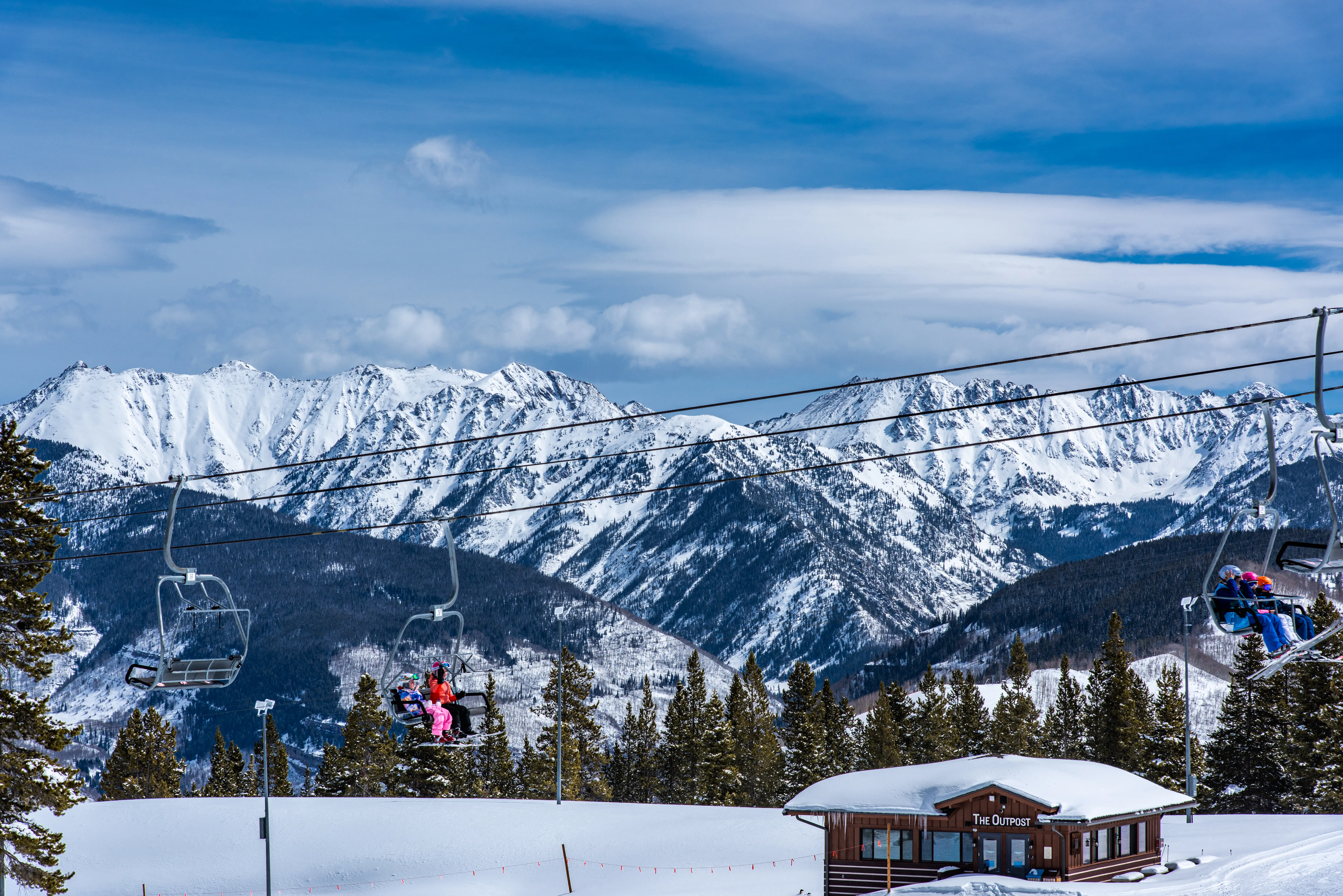 Skiers on lift at Vail resort