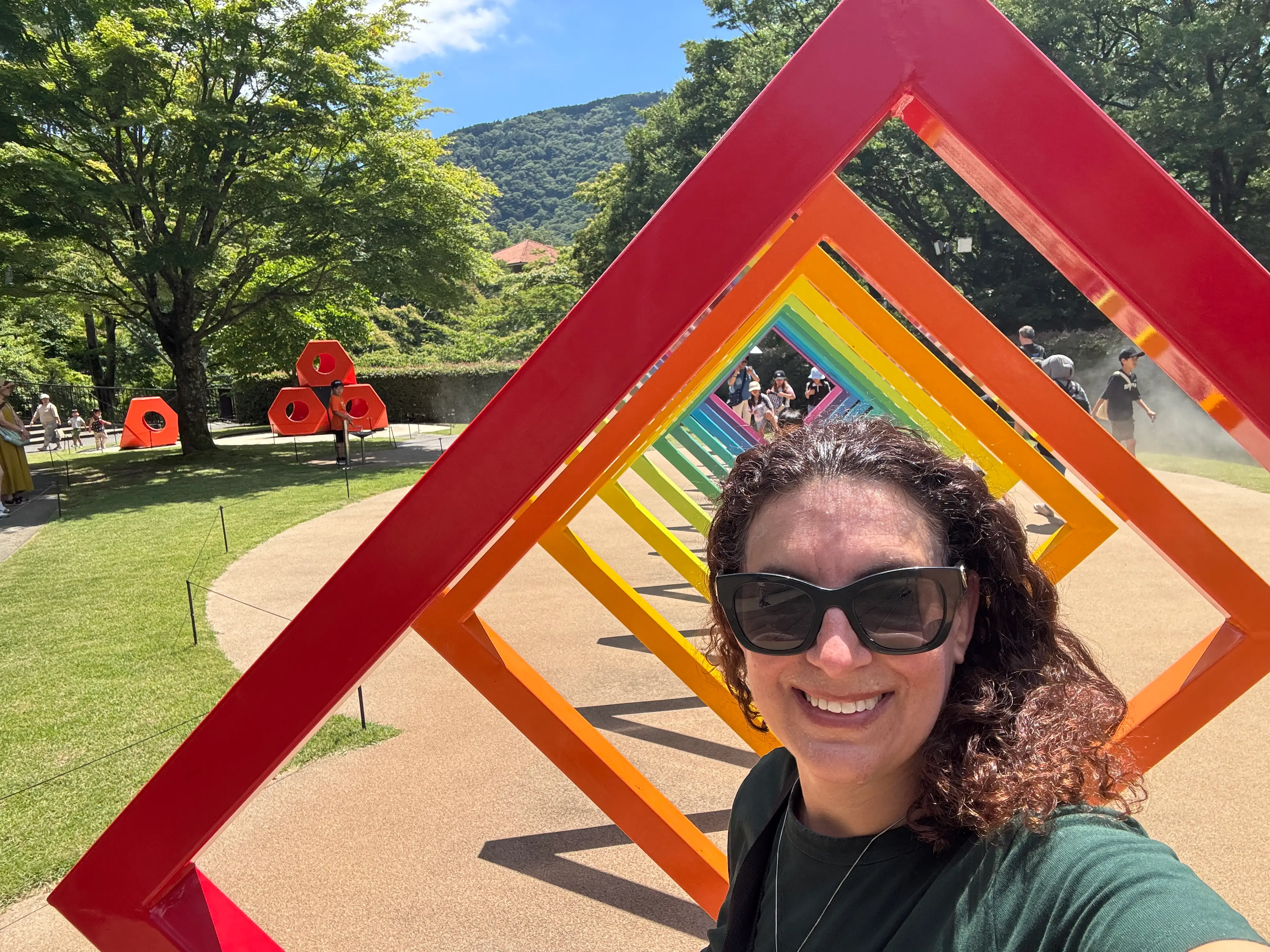Woman smiling in rainbow square structure